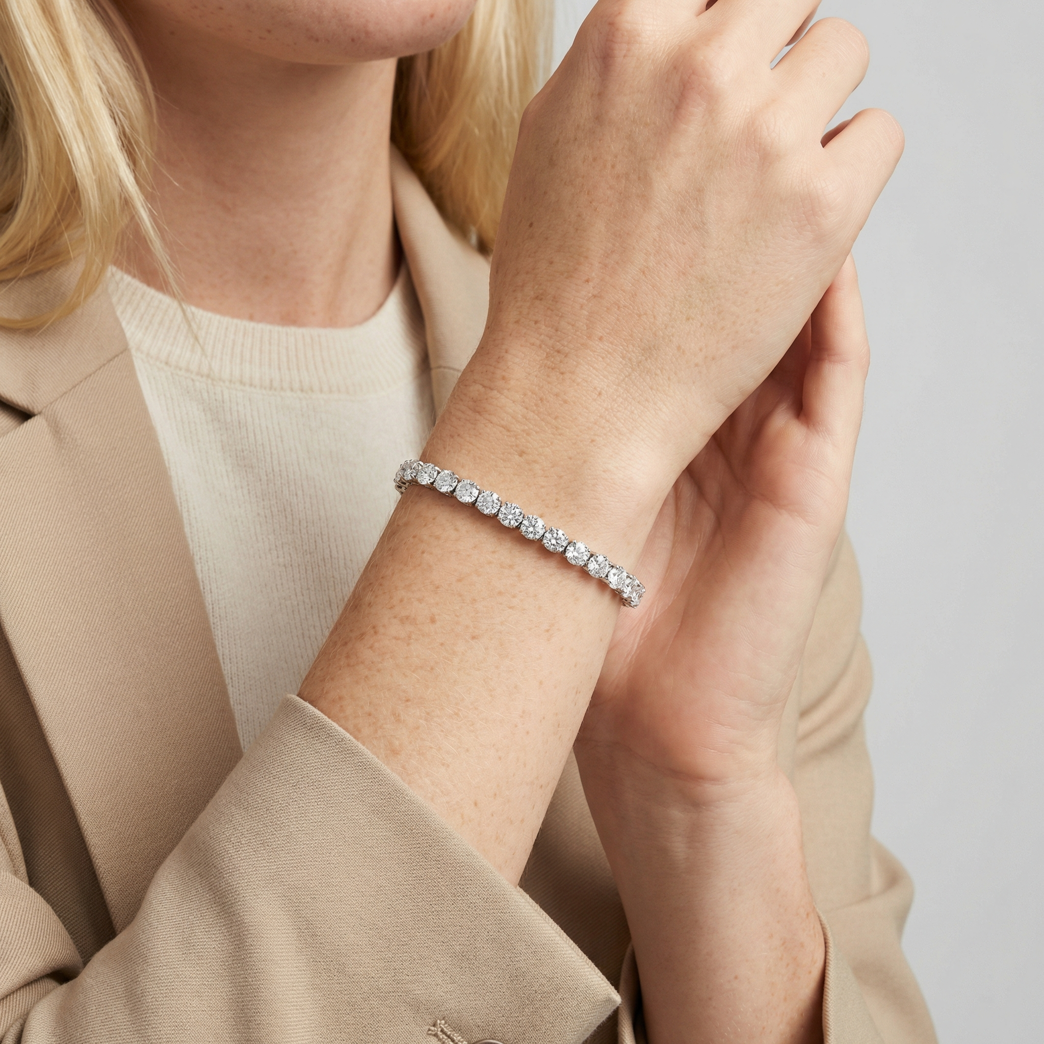 10 carat round lab grown diamond tennis bracelet in 14k white gold on wrist by Michael Gabriels