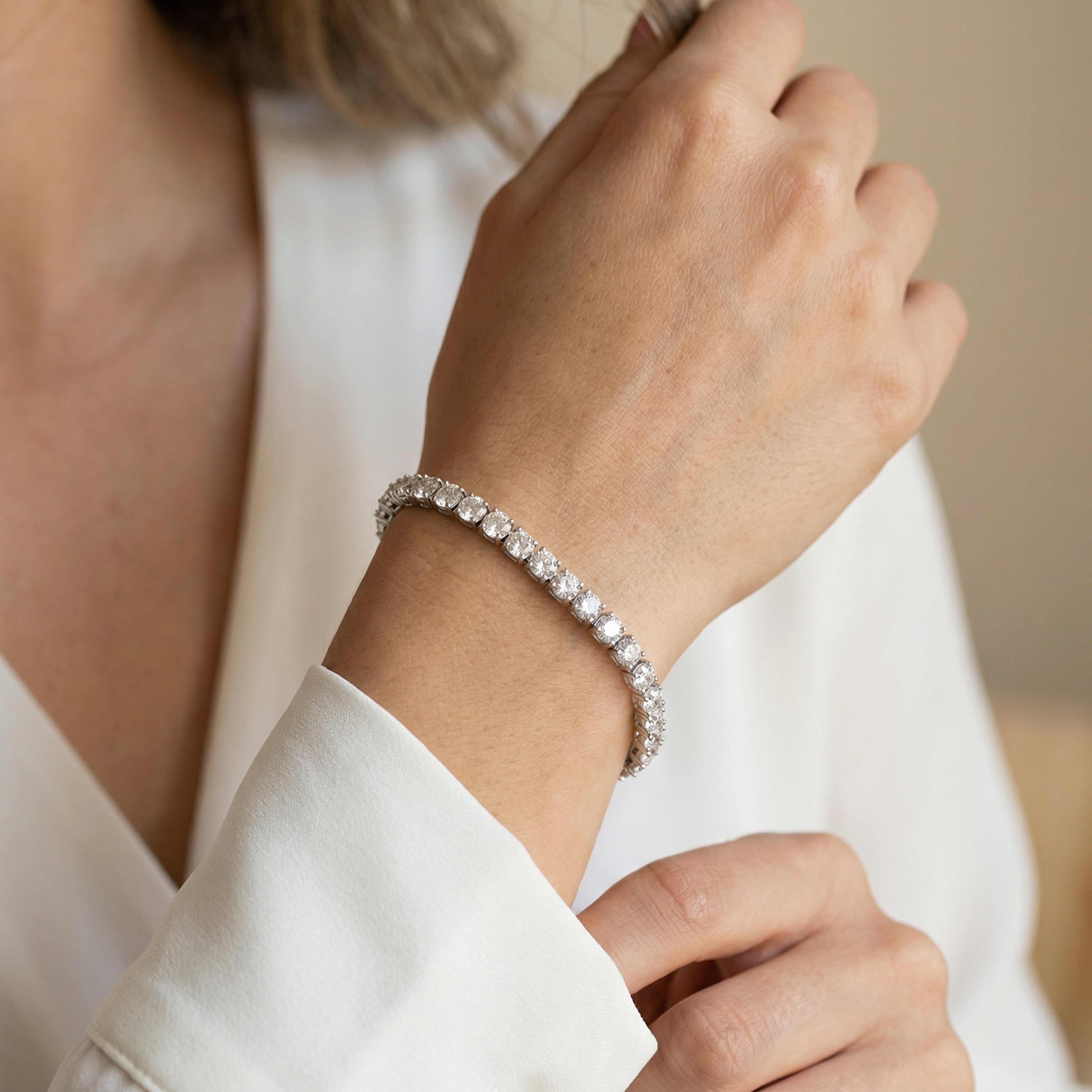 14 carat round lab grown diamond tennis bracelet in 14k white gold on wrist by Michael Gabriels