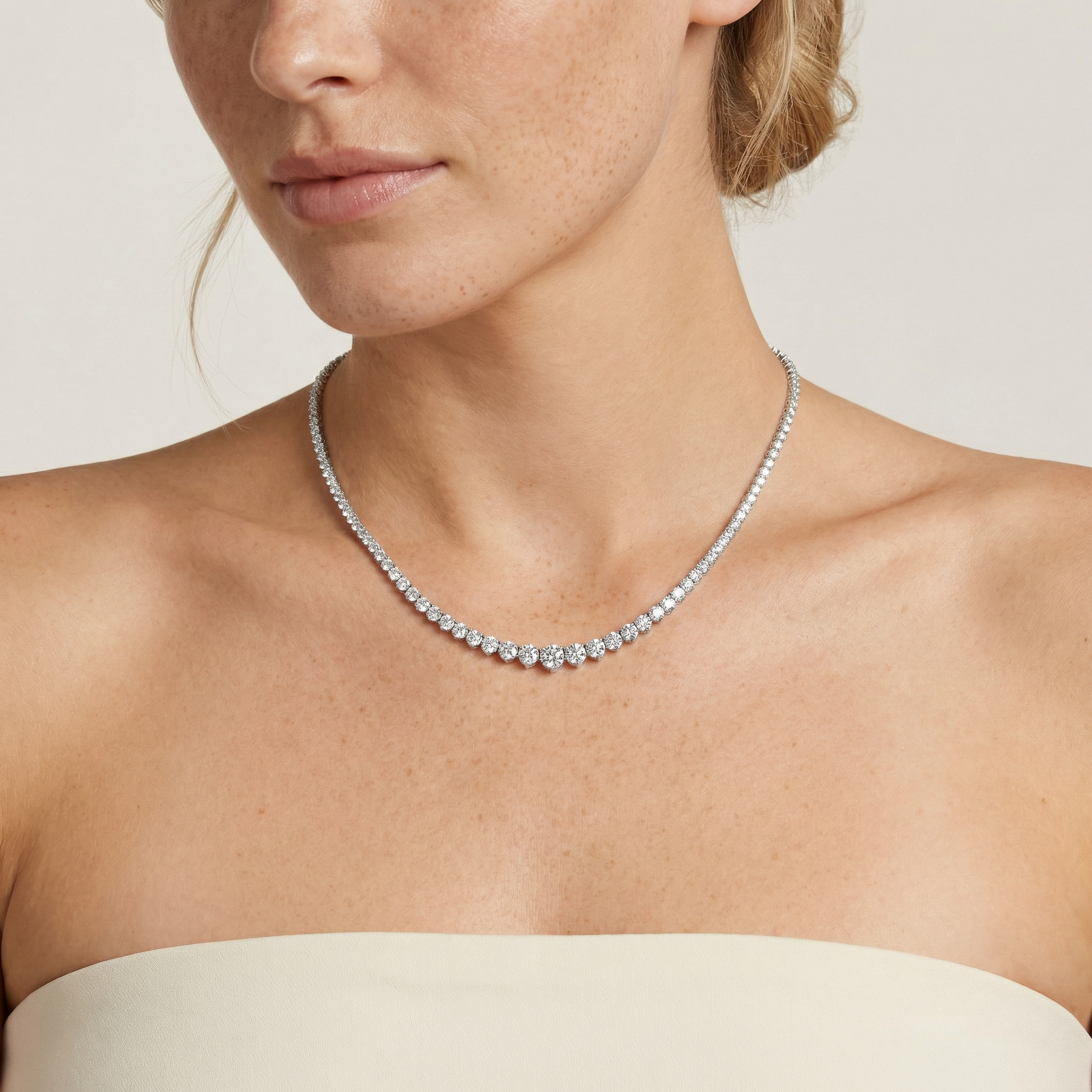 15 carat lab grown diamond graduated tennis necklace in 14k white gold on neck by Michael Gabriels
