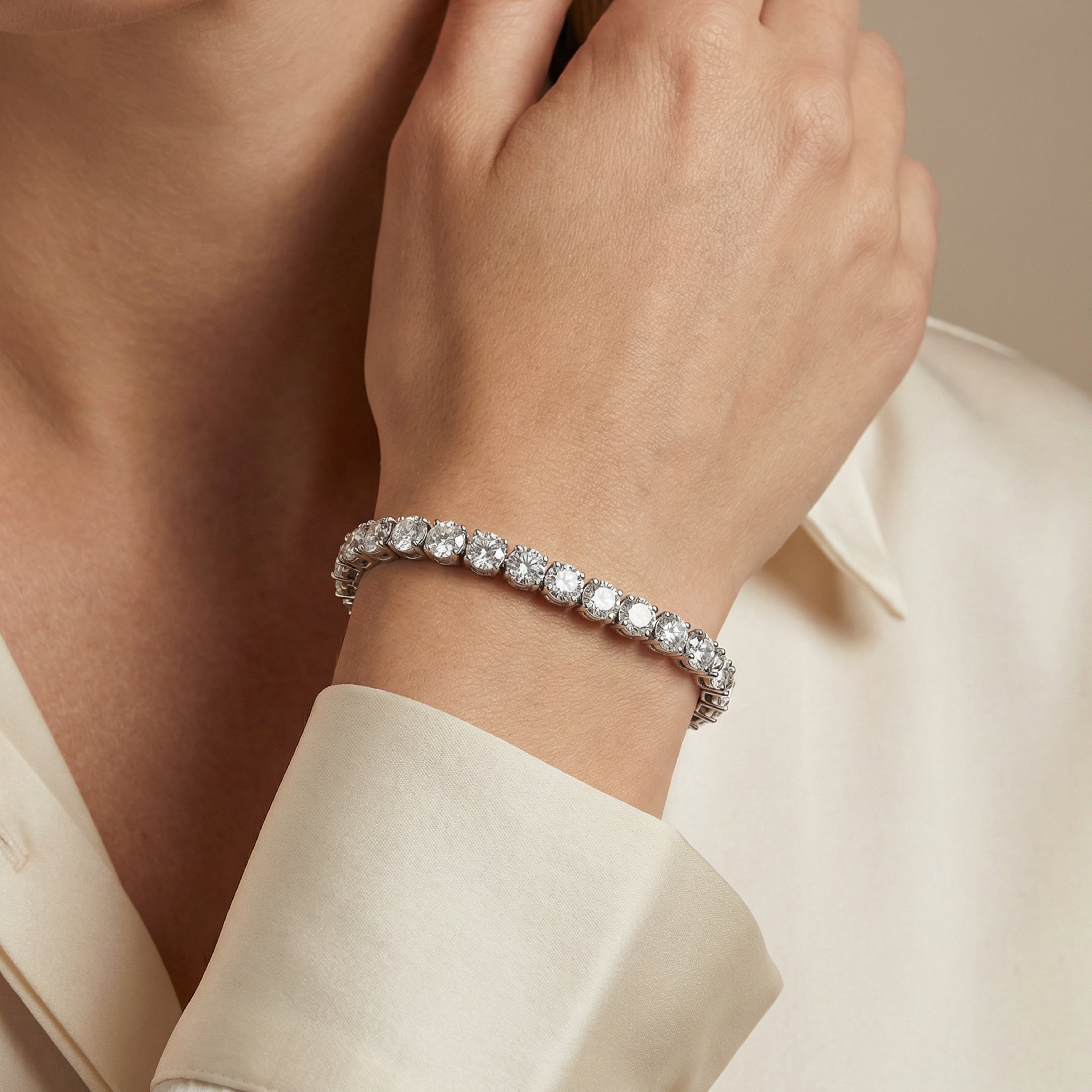 24 carat round lab grown diamond tennis bracelet in 14k white gold on wrist by Michael Gabriels