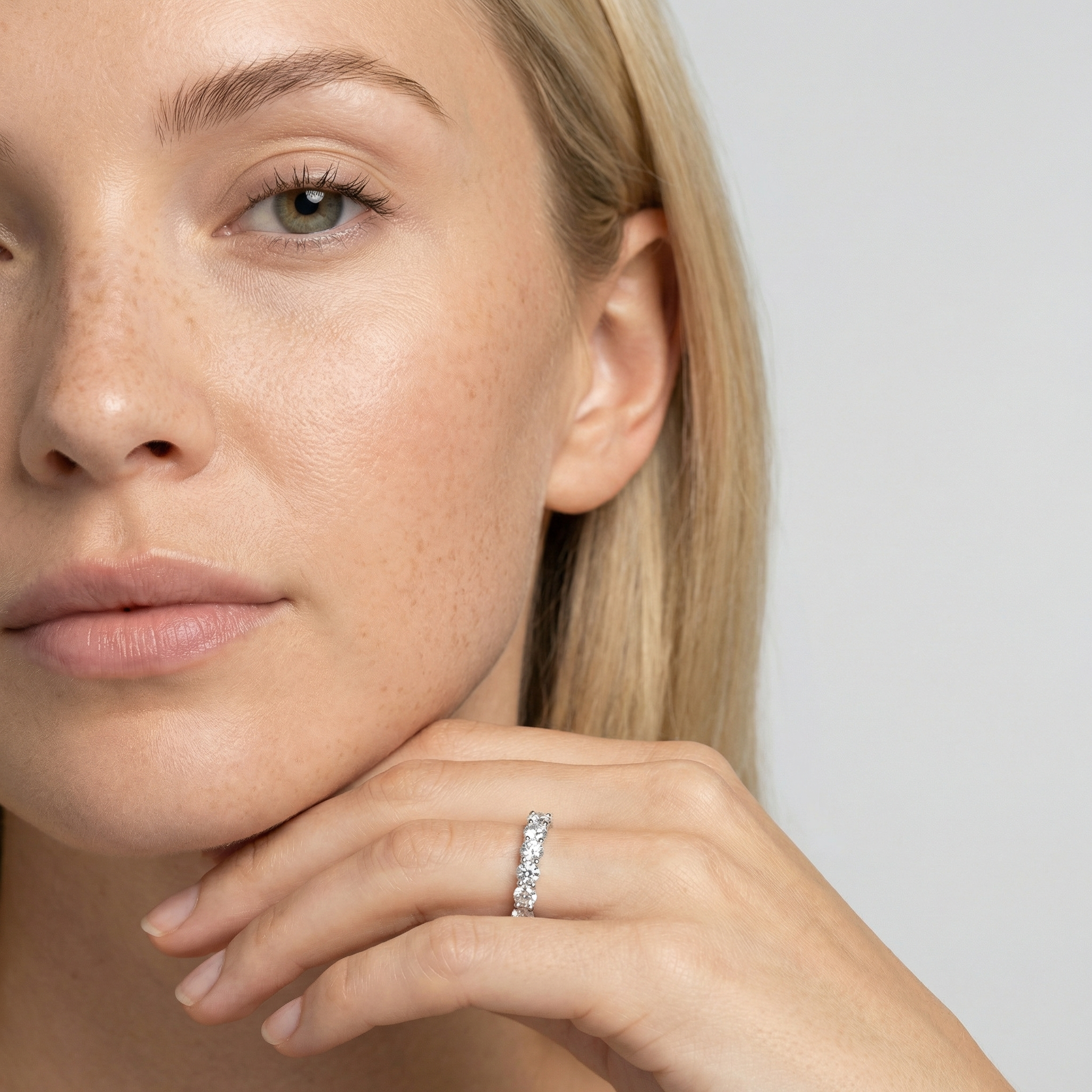 3 carat round lab grown diamond basket eternity band in 14k white gold on finger by Michael Gabriels