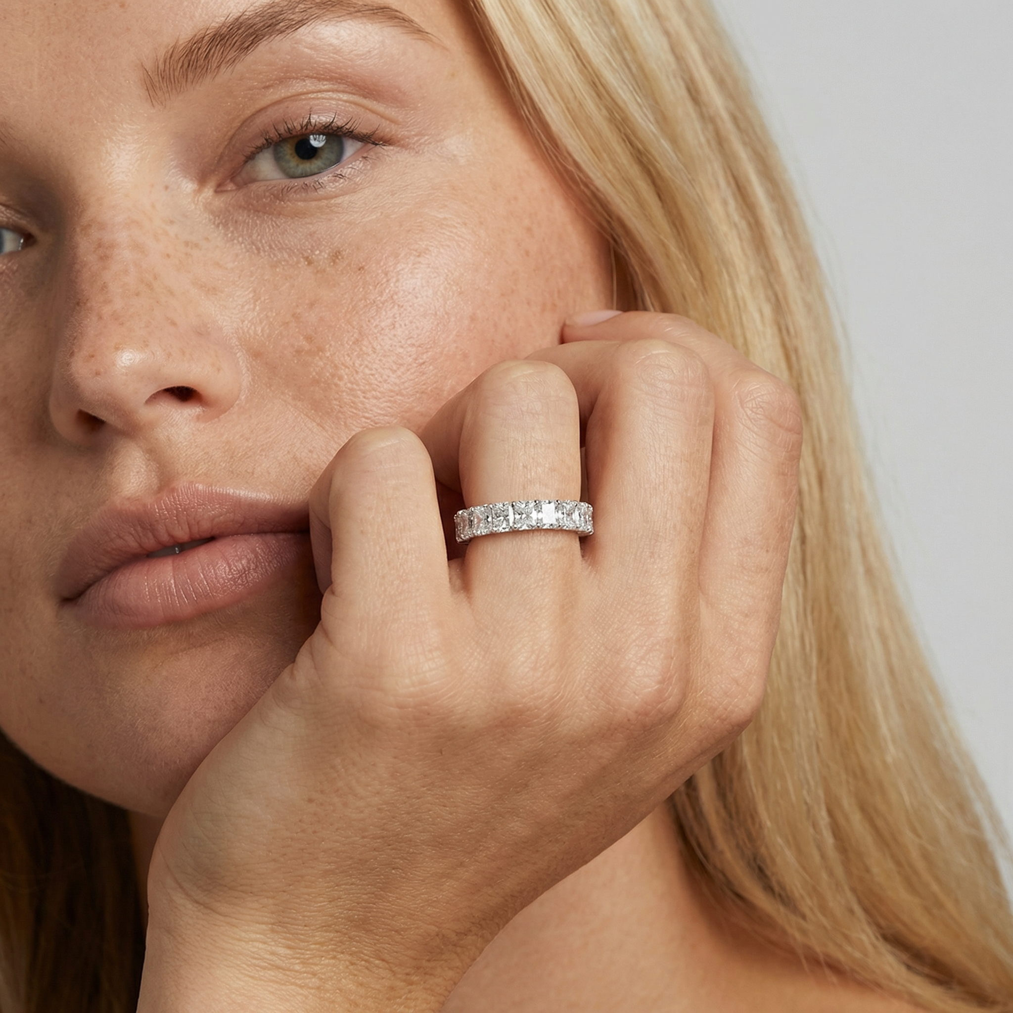 4 carat radiant lab grown diamond basket eternity band in 14k white gold on finger by Michael Gabriels