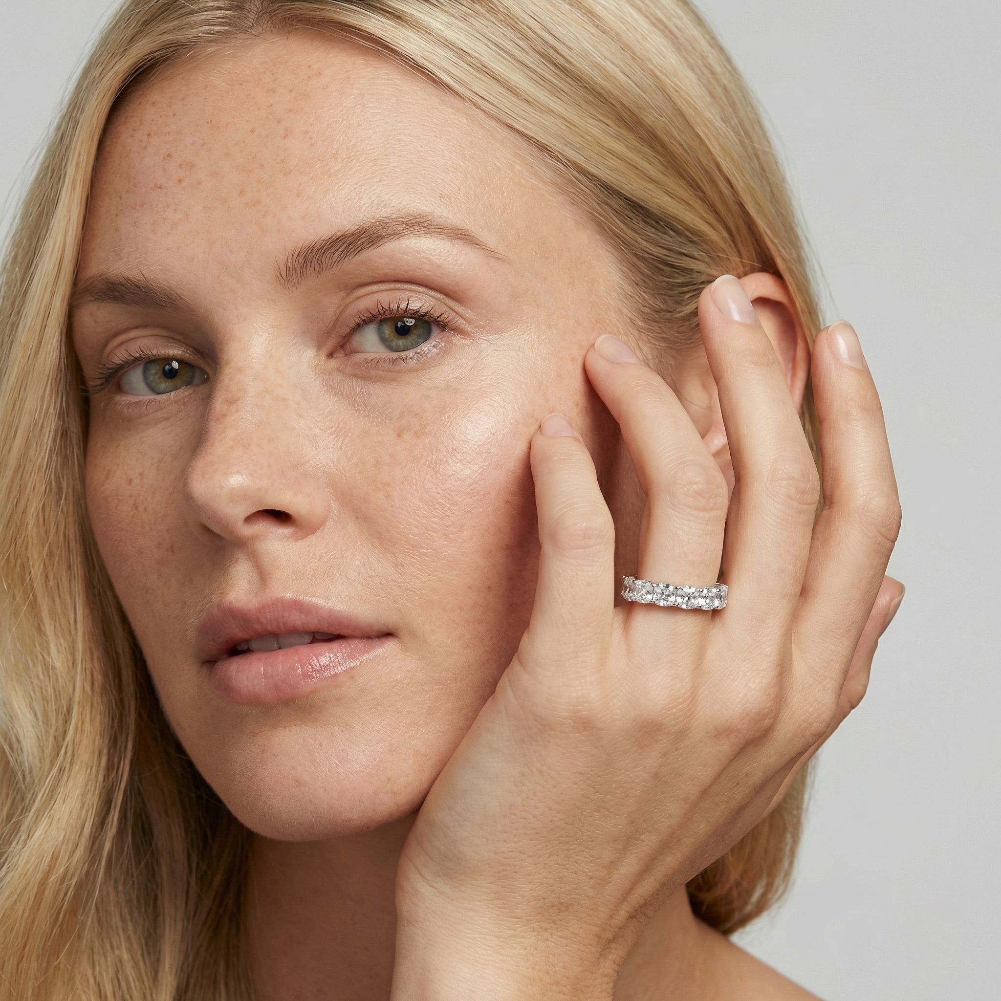 5 carat cushion lab grown diamond basket eternity band in 14k white gold on finger by Michael Gabriels