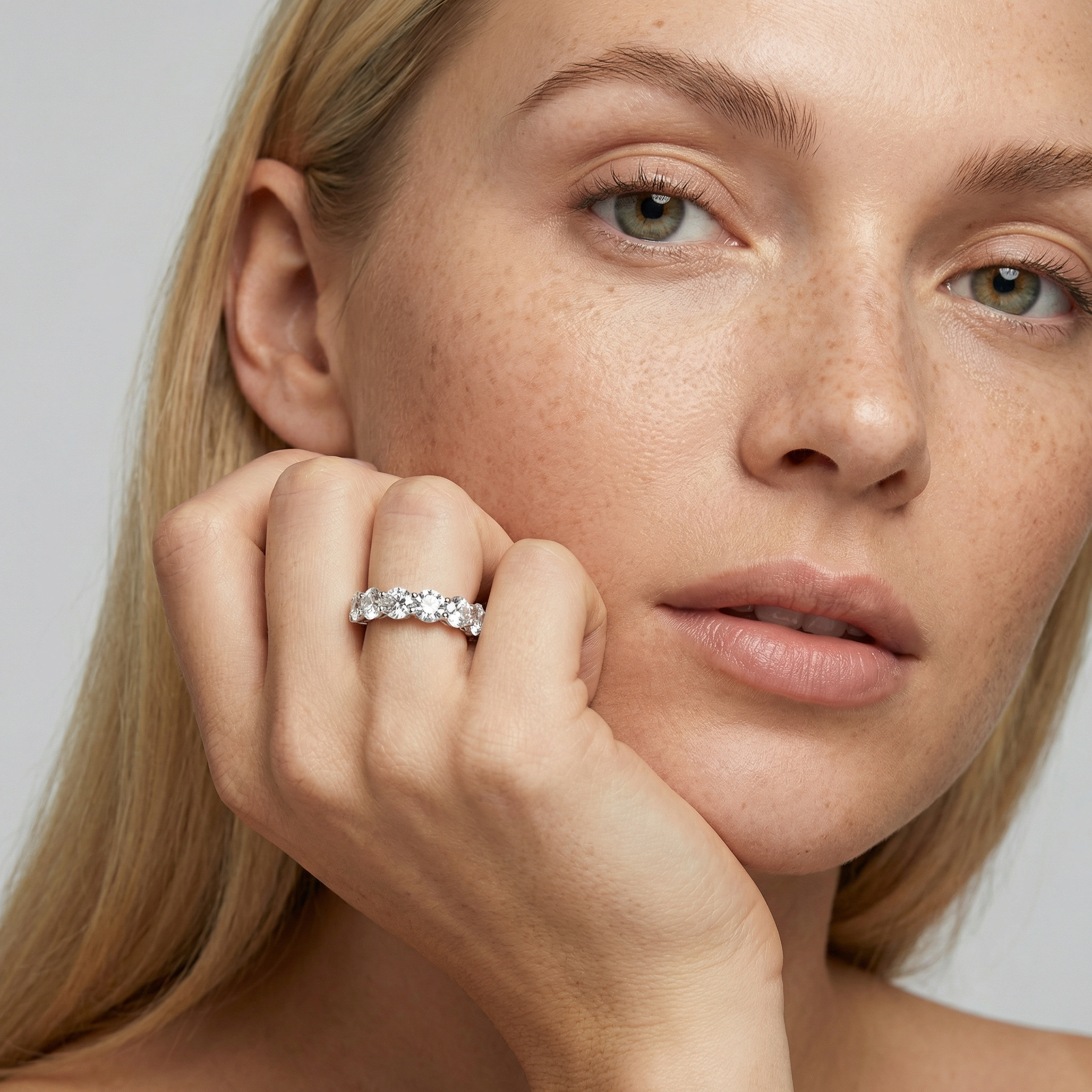 5 carat round lab grown diamond basket eternity band in 14k white gold on finger by Michael Gabriels