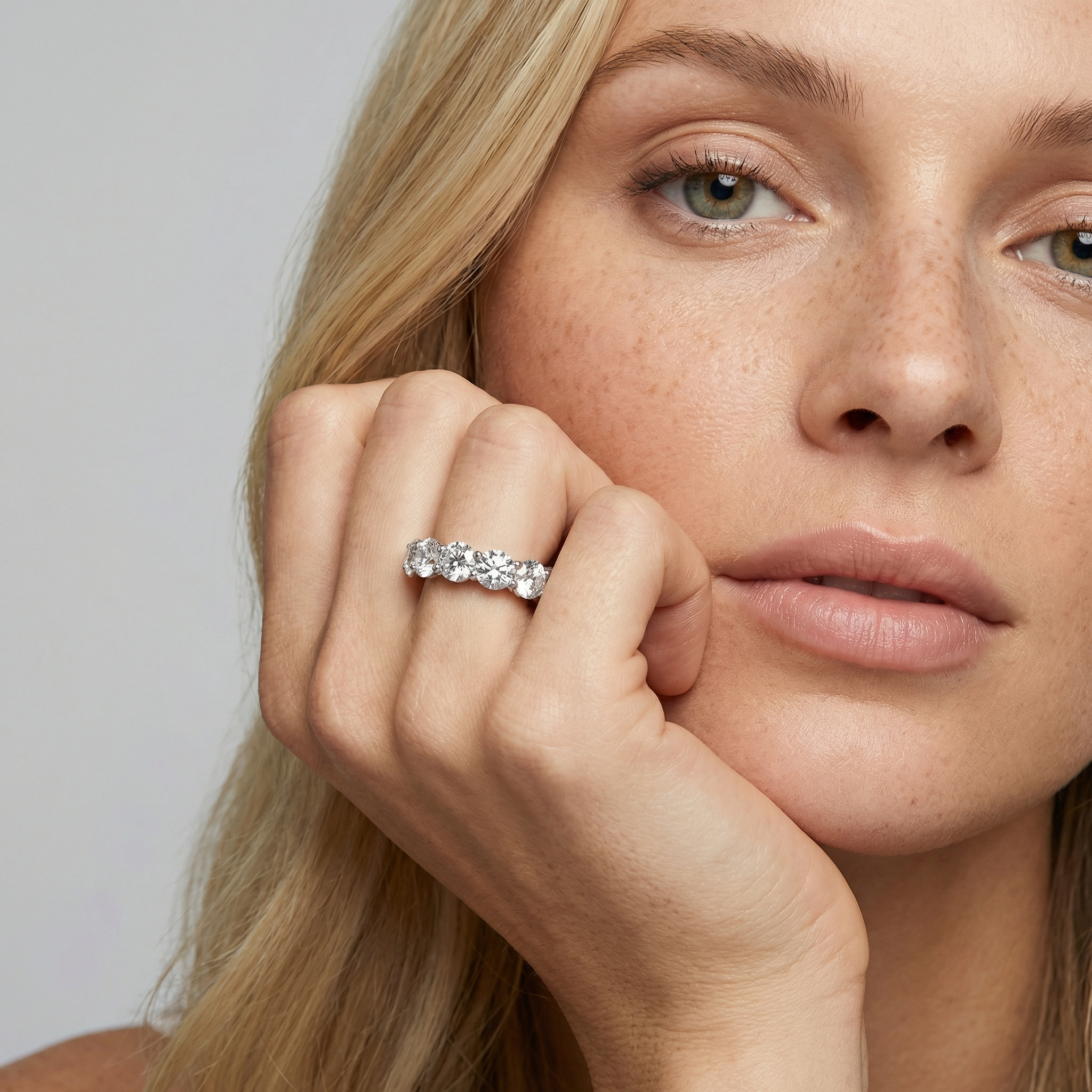 6 carat round lab grown diamond basket eternity band in 14k white gold on finger by Michael Gabriels