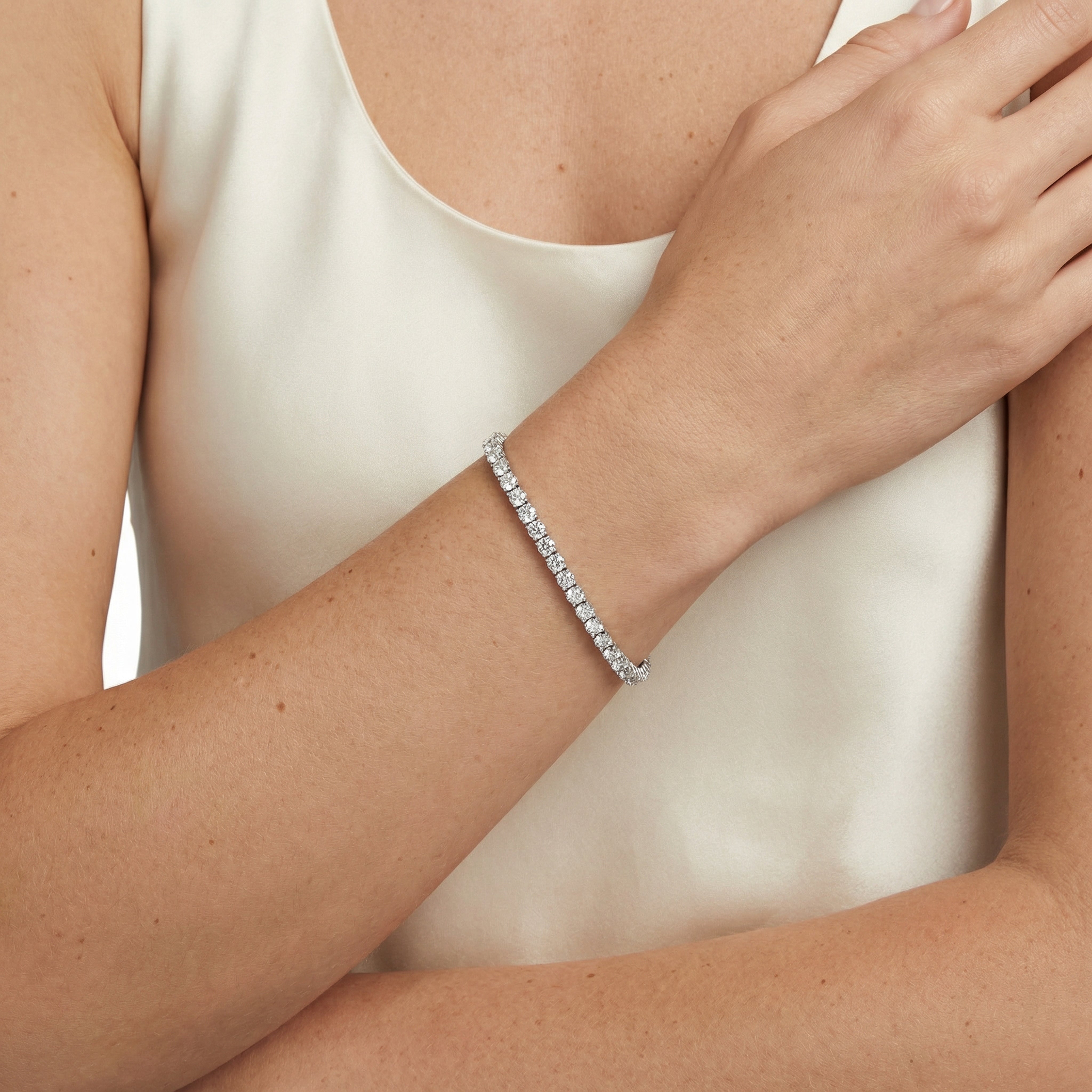 6 carat round lab grown diamond tennis bracelet in 14k white gold on wrist by Michael Gabriels