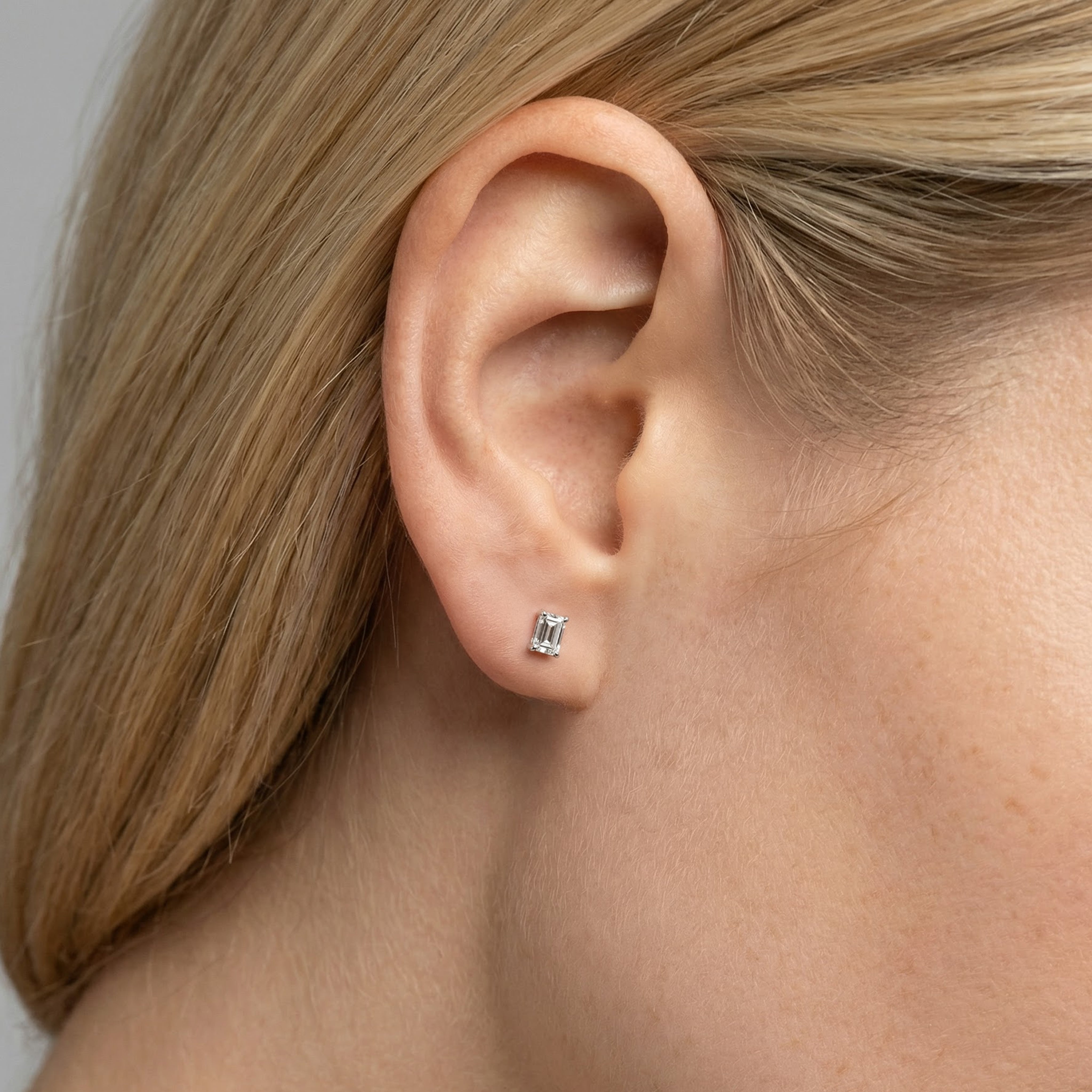 .75 carat emerald lab grown diamond stud earring in 14k white gold on ear by Michael Gabriels