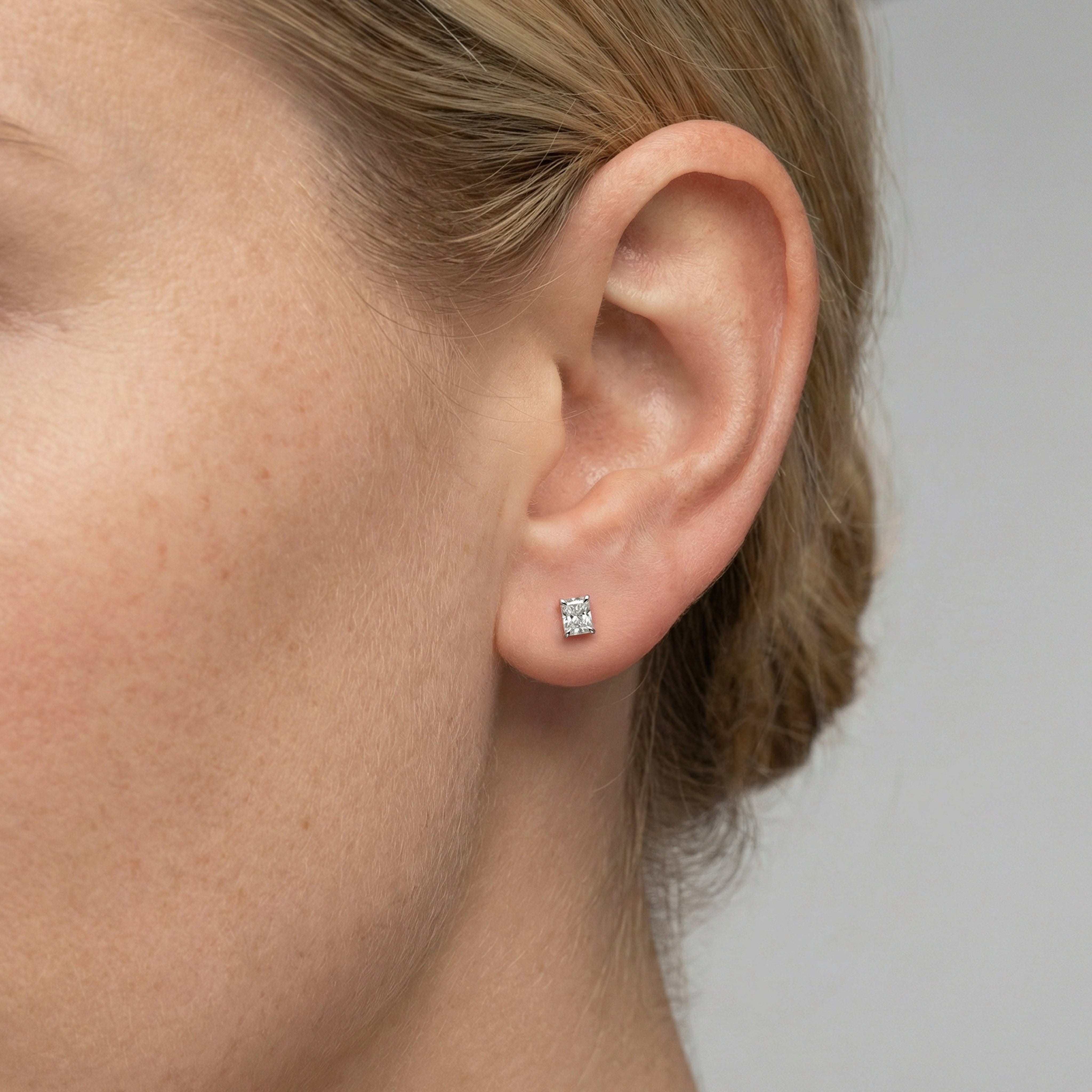.75 carat radiant lab grown diamond stud earring in 14k white gold on ear by Michael Gabriels