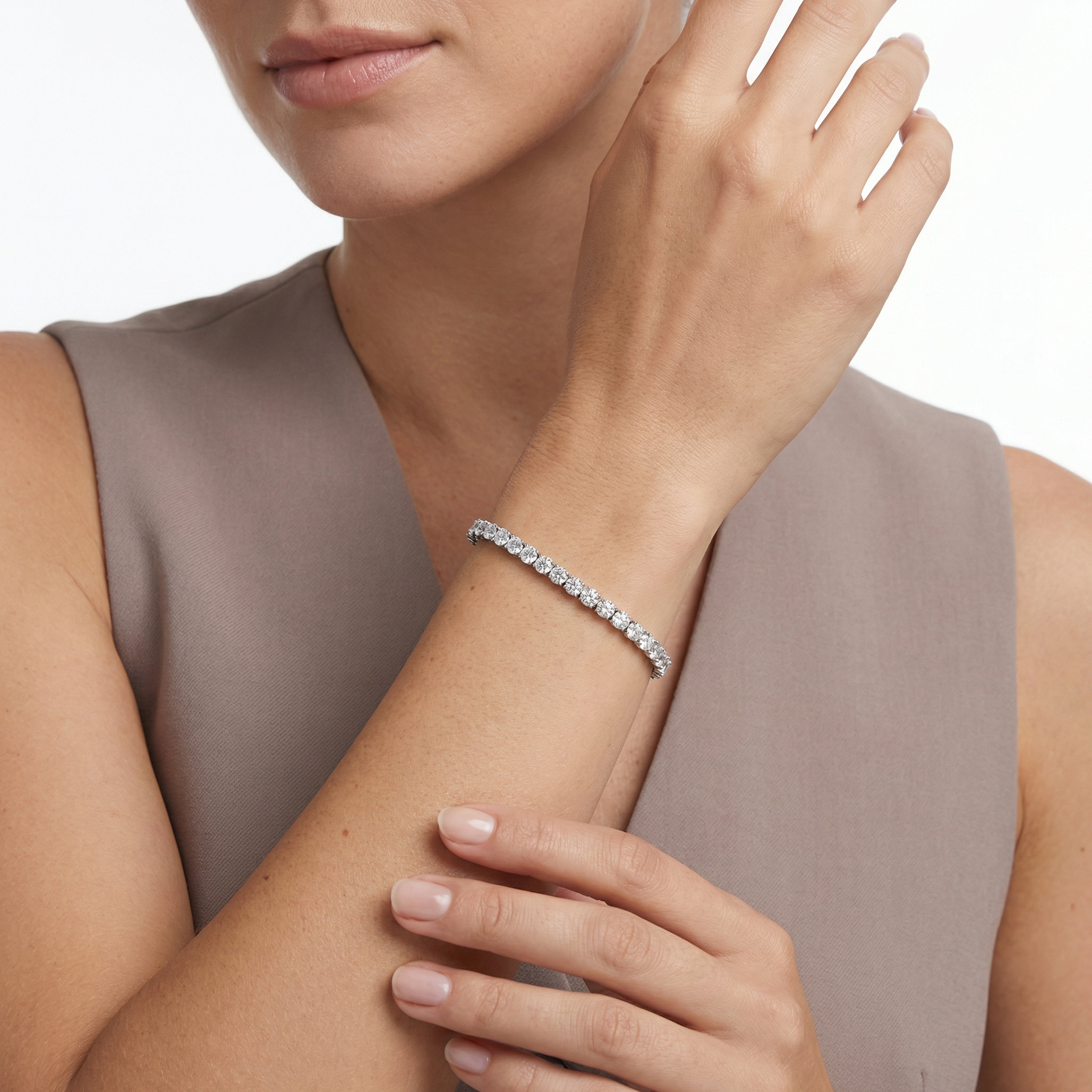 7 carat round lab grown diamond tennis bracelet in 14k white gold on wrist by Michael Gabriels