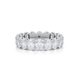 Small white gold eternity band with vertical oval lab-grown diamonds.