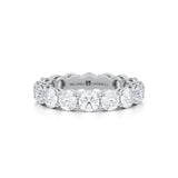 Small white gold eternity band with round lab grown diamonds.