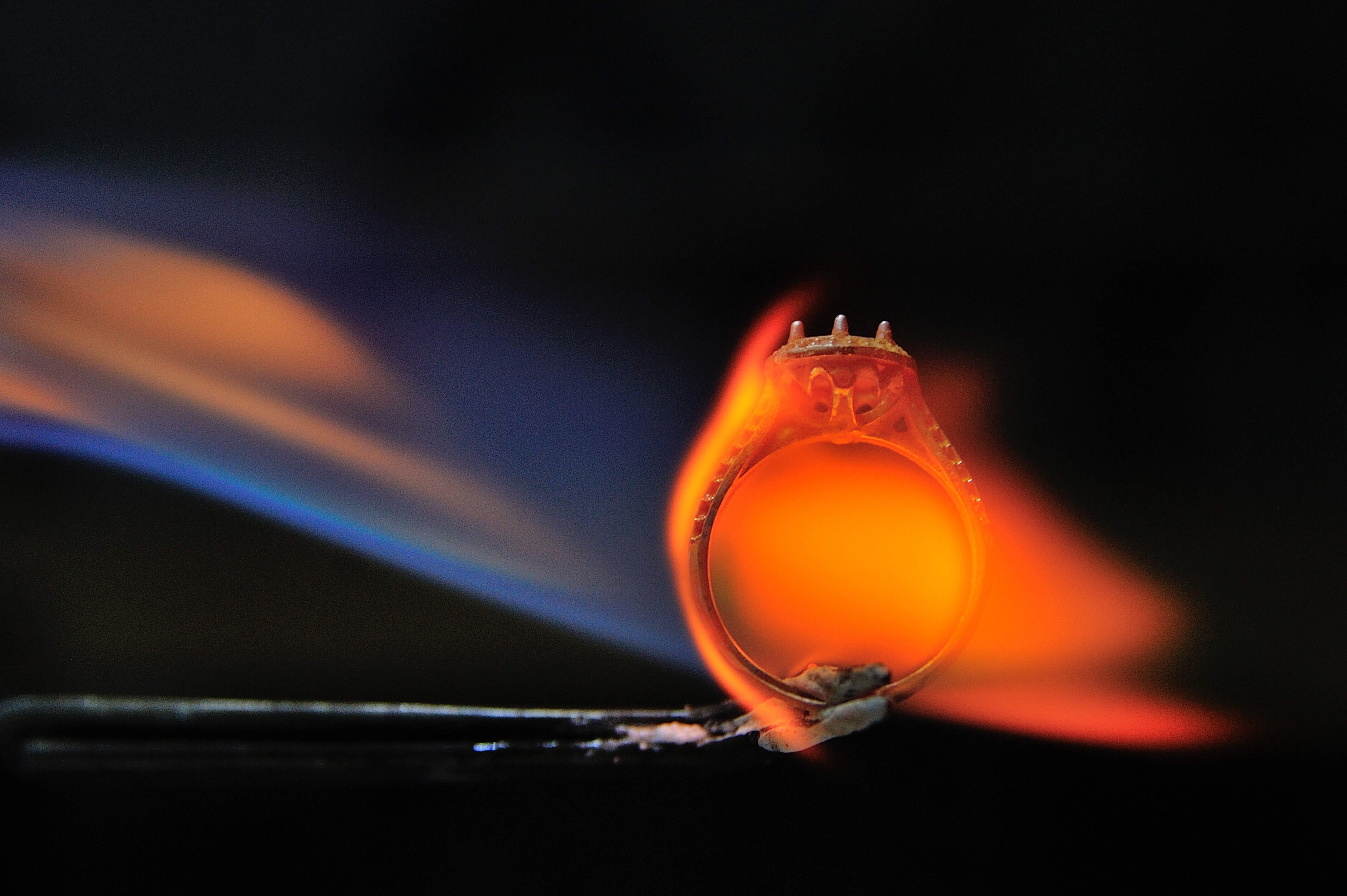 A custom ring being heated 