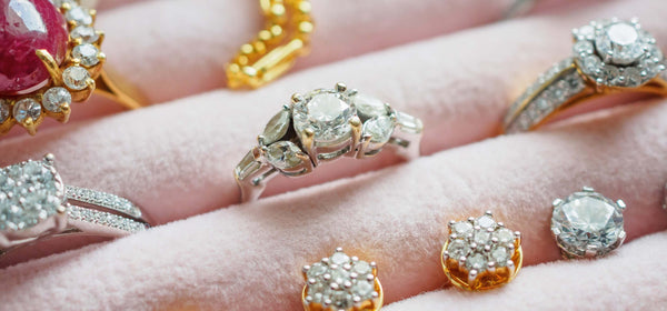 Several lab-grown diamond engagement rings and jewelry