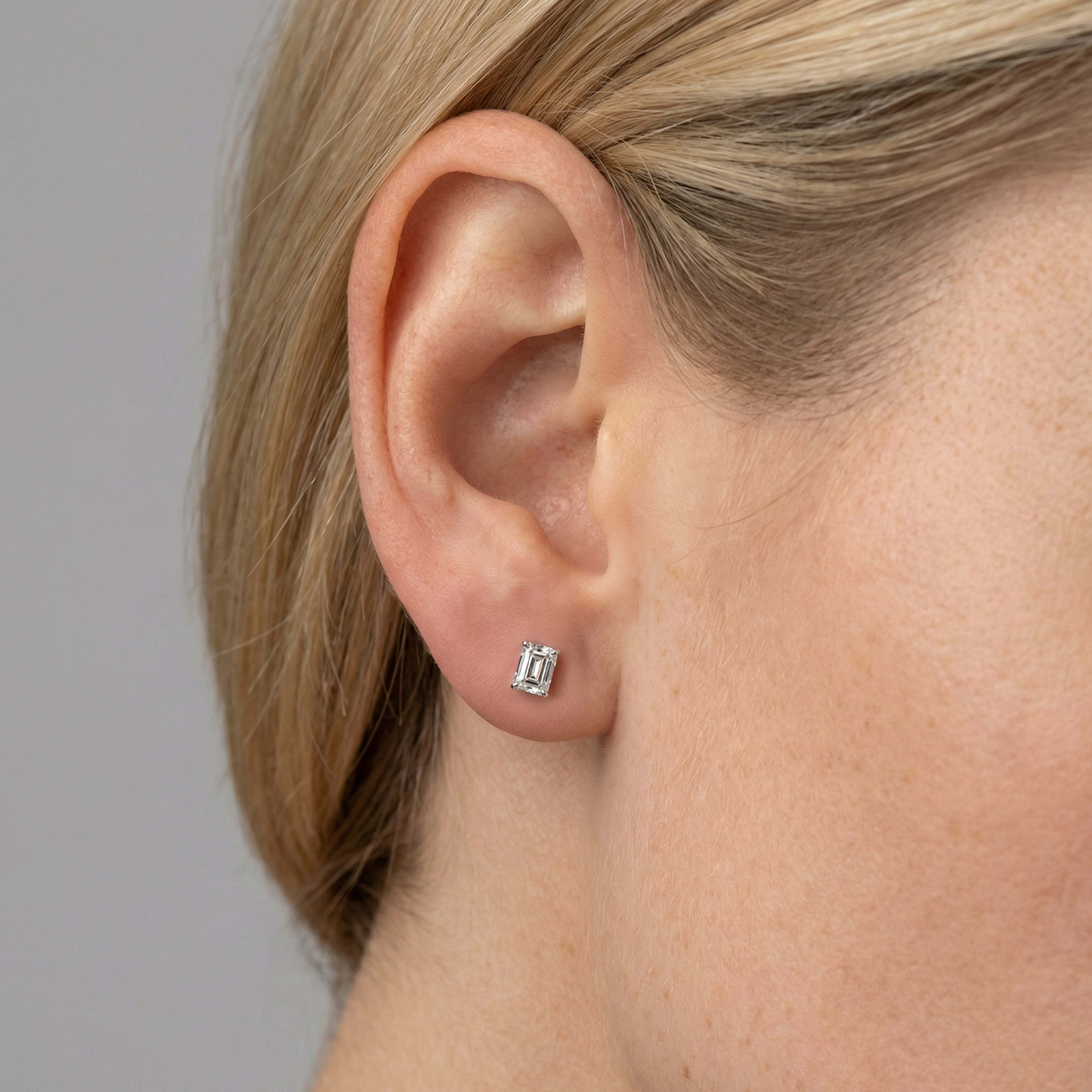 1.25 carat emerald lab grown diamond stud earring in 14k white gold on ear by Michael Gabriels