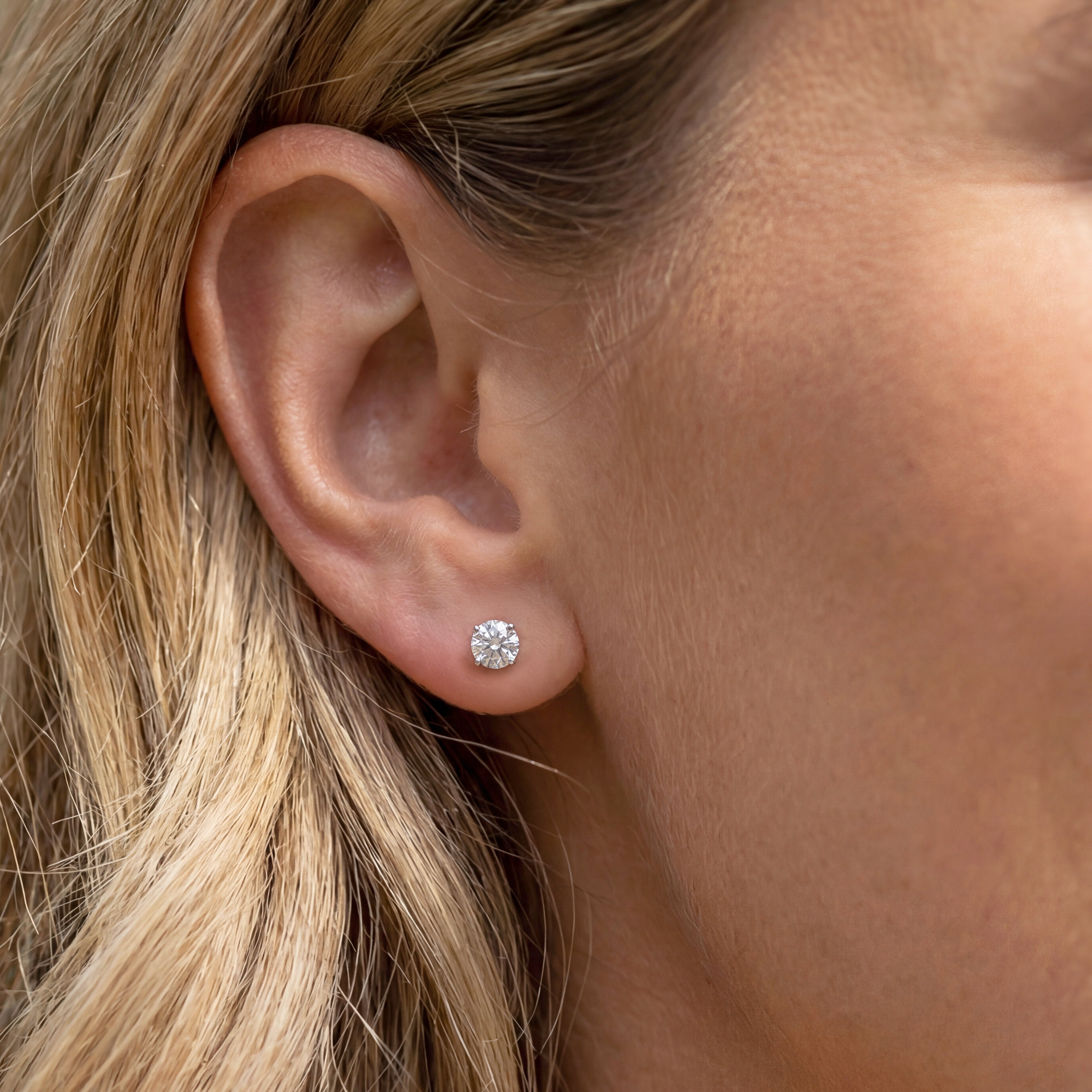 1.50 carat round lab grown diamond stud earring in 14k white gold on ear by Michael Gabriels