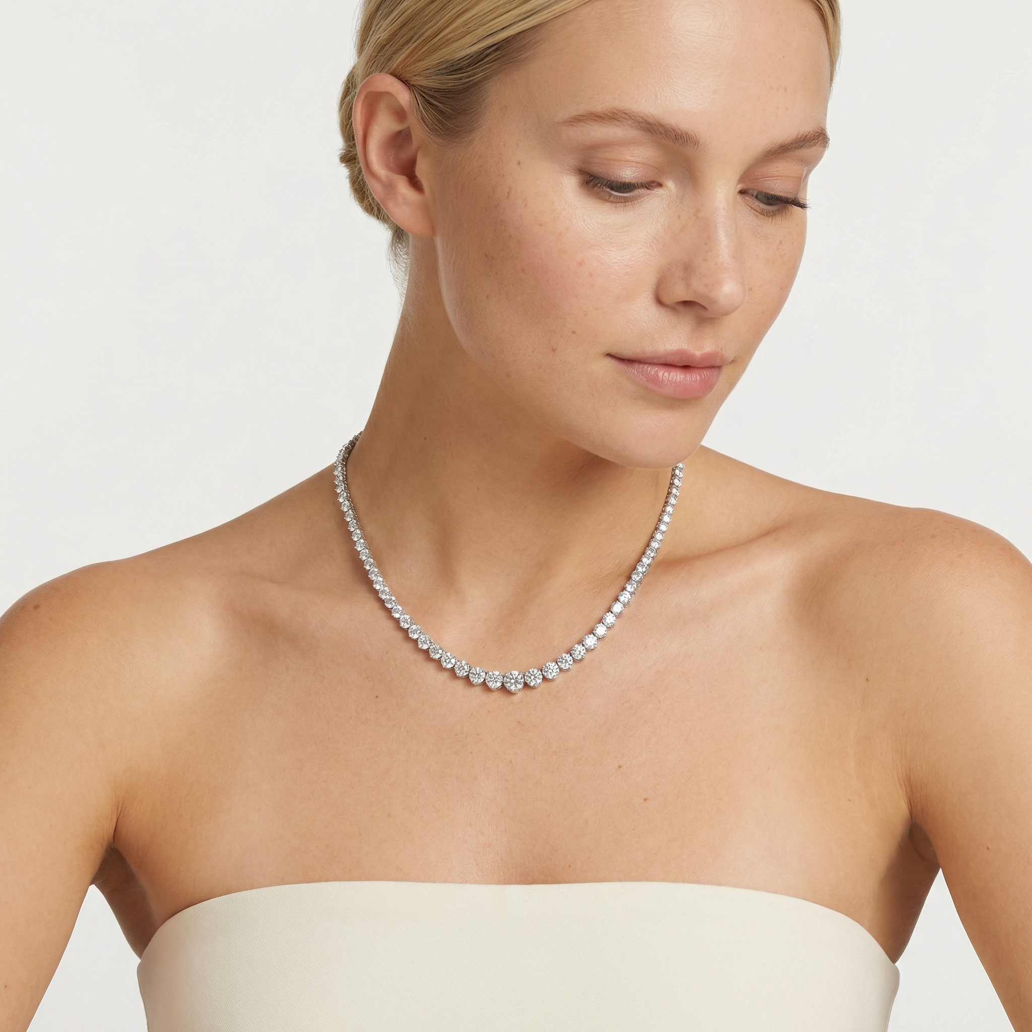 18 carat lab grown diamond graduated tennis necklace in 14k white gold on neck by Michael Gabriels
