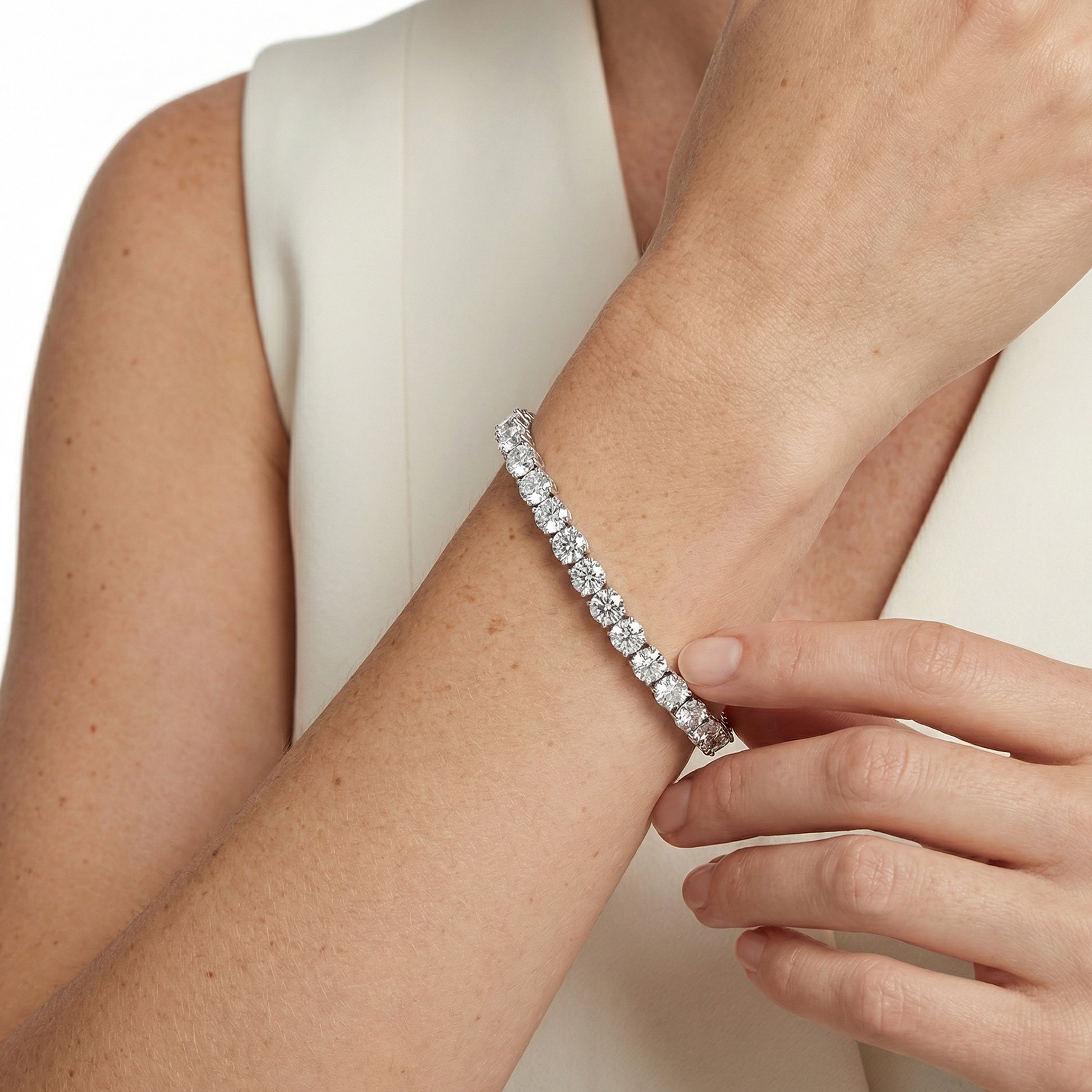 18 carat round lab grown diamond tennis bracelet in 14k white gold on wrist by Michael Gabriels