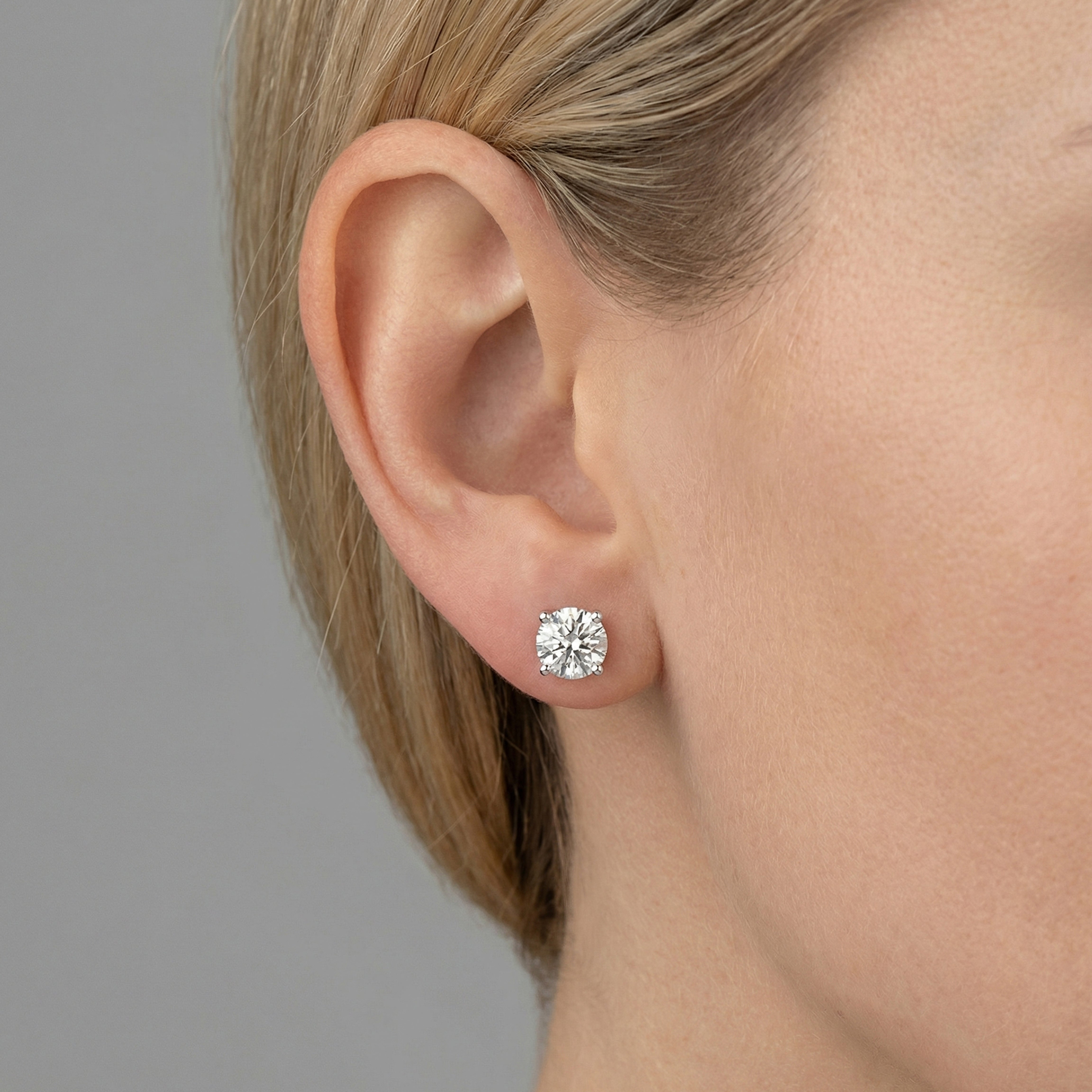 2.50 carat round lab grown diamond stud earring in 14k white gold on ear by Michael Gabriels