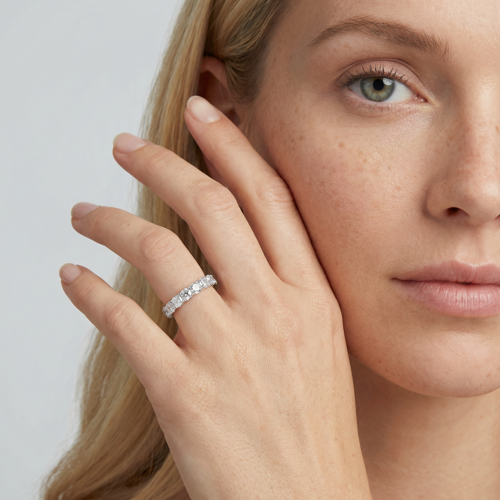 3 carat cushion lab grown diamond basket eternity band in 14k white gold on finger by Michael Gabriels