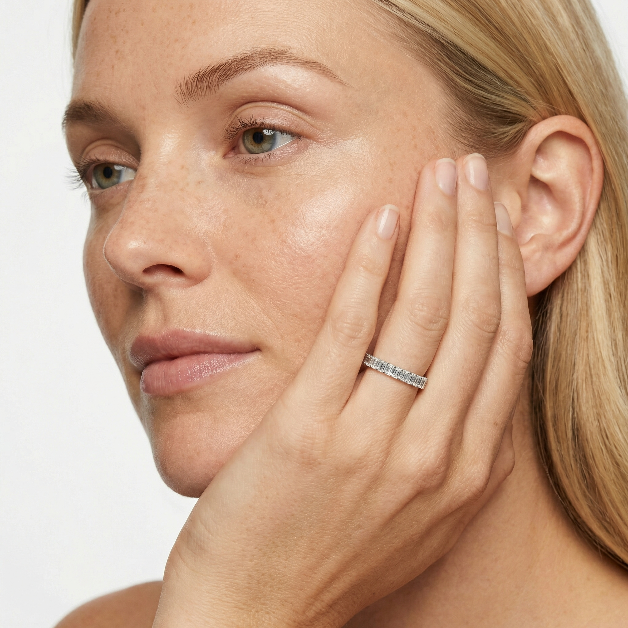 3 carat emerald lab grown diamond basket eternity band in 14k white gold on finger by Michael Gabriels