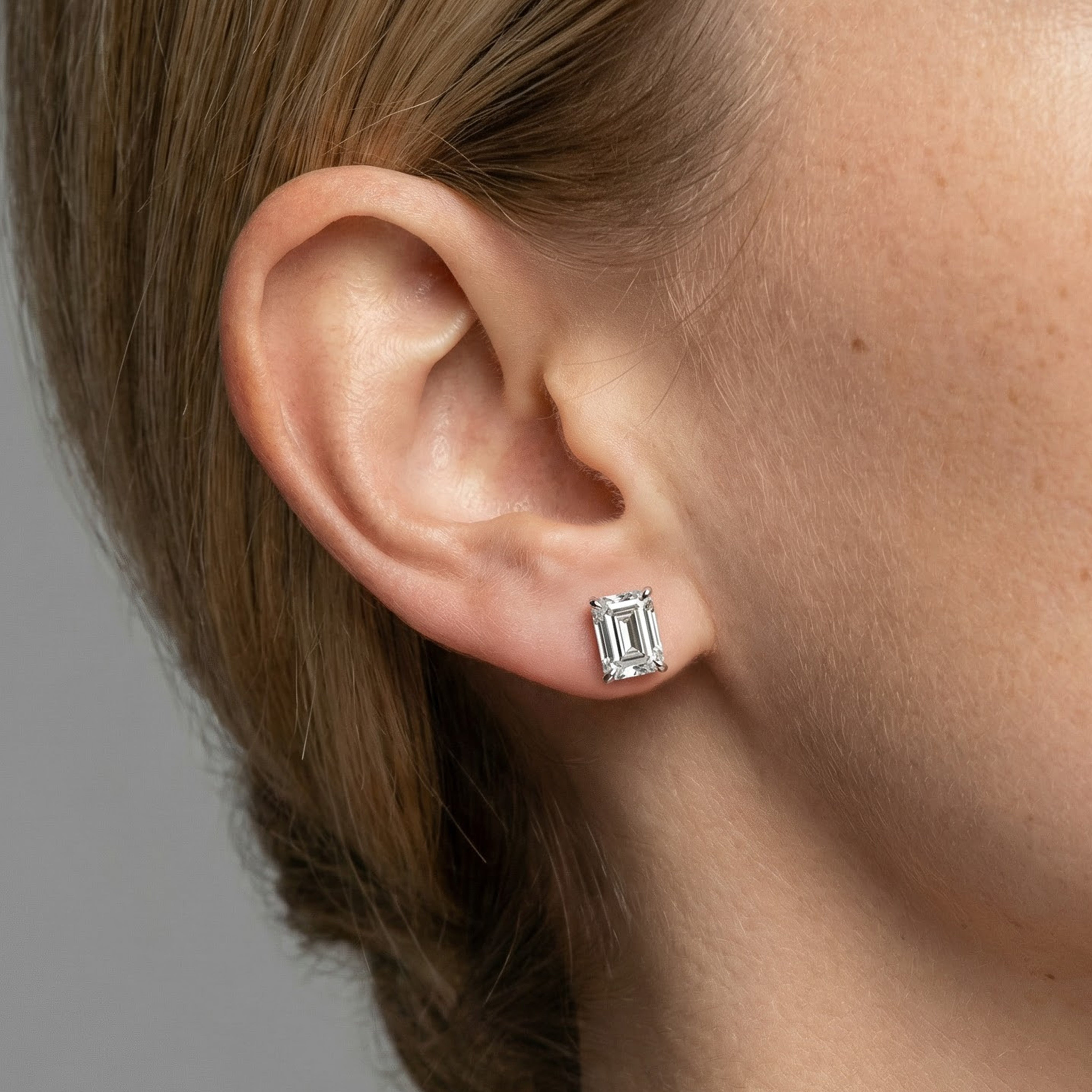 3 carat emerald lab grown diamond stud earring in 14k white gold on ear by Michael Gabriels