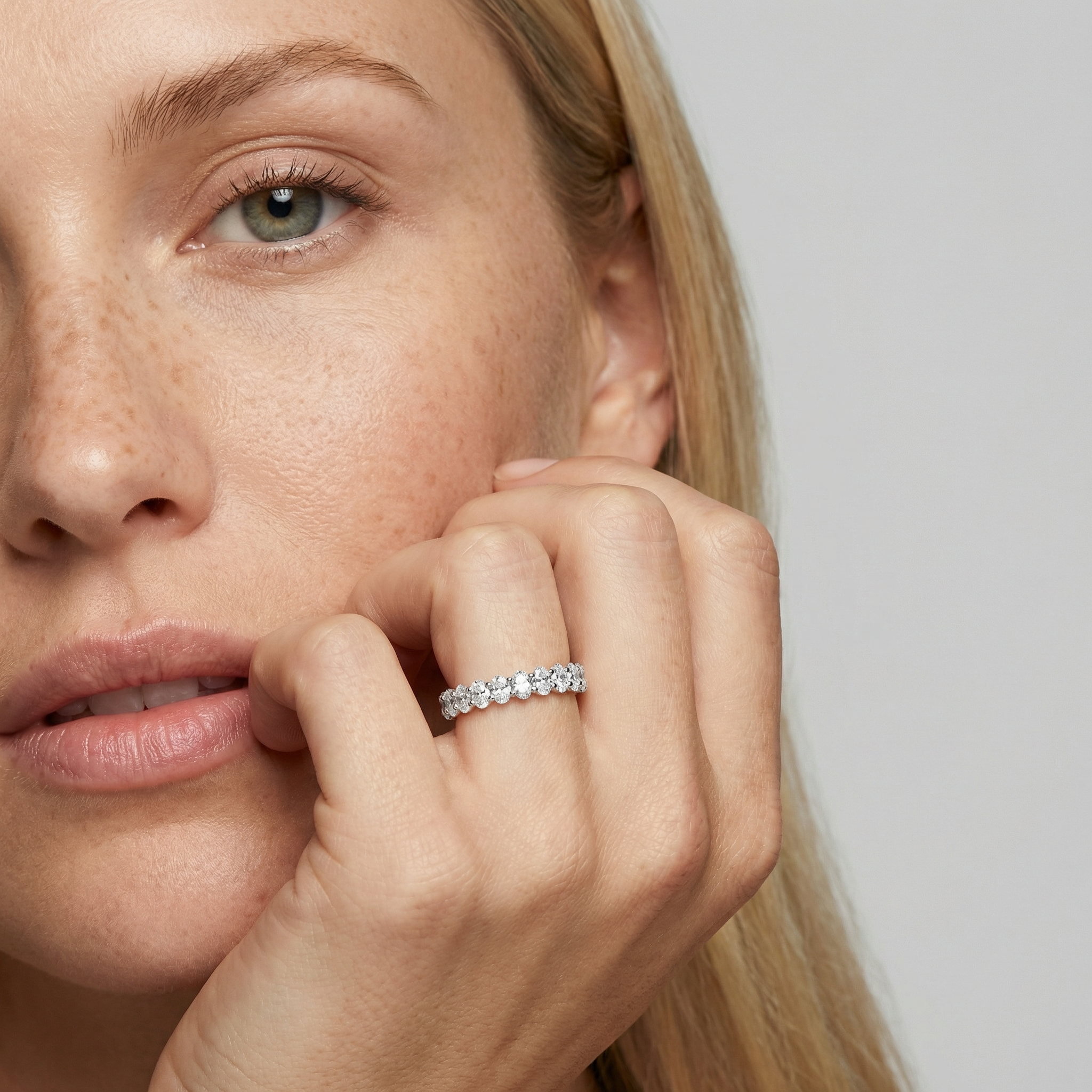 3 carat oval lab grown diamond basket eternity band in 14k white gold on finger by Michael Gabriels