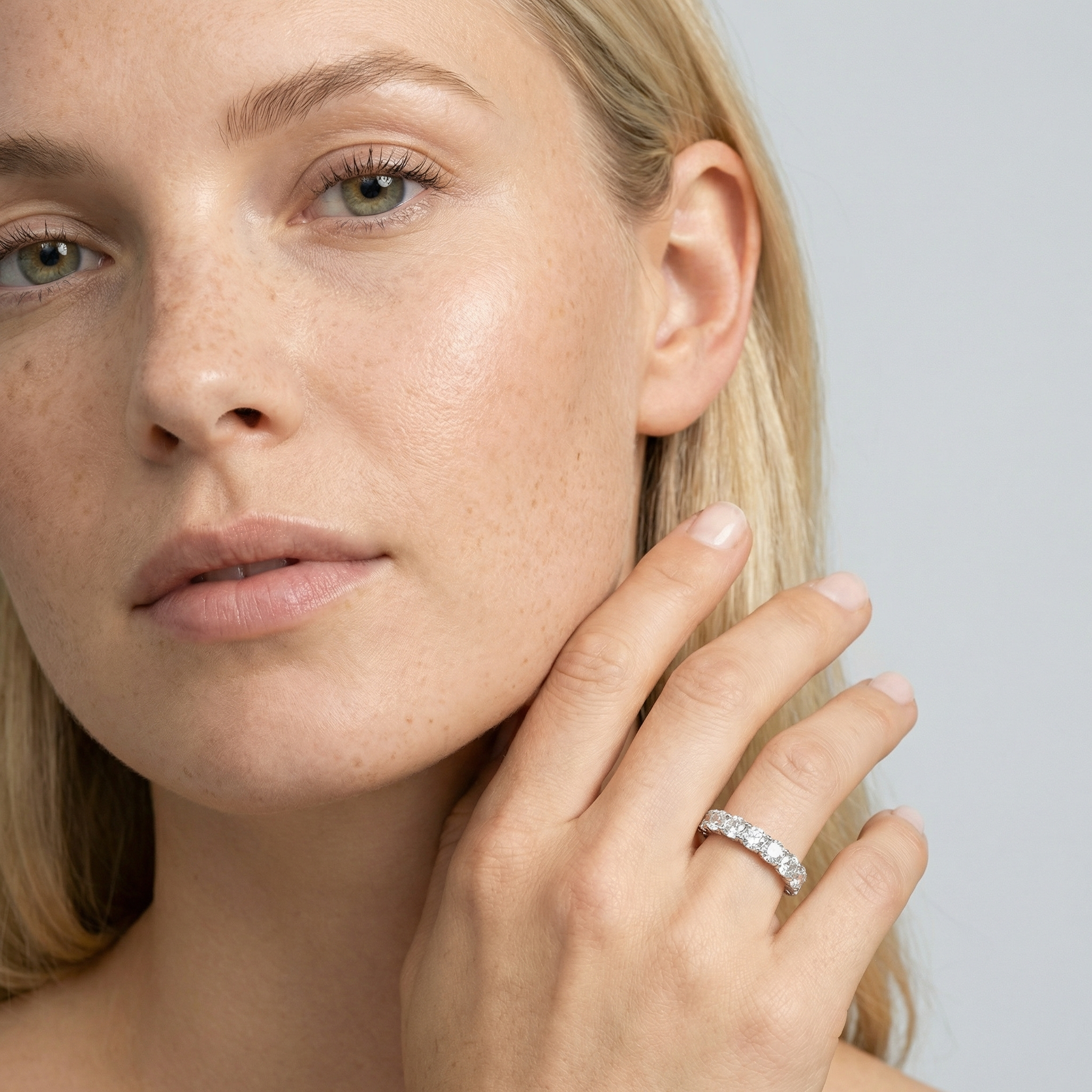 4 carat cushion lab grown diamond basket eternity band in 14k white gold on finger by Michael Gabriels