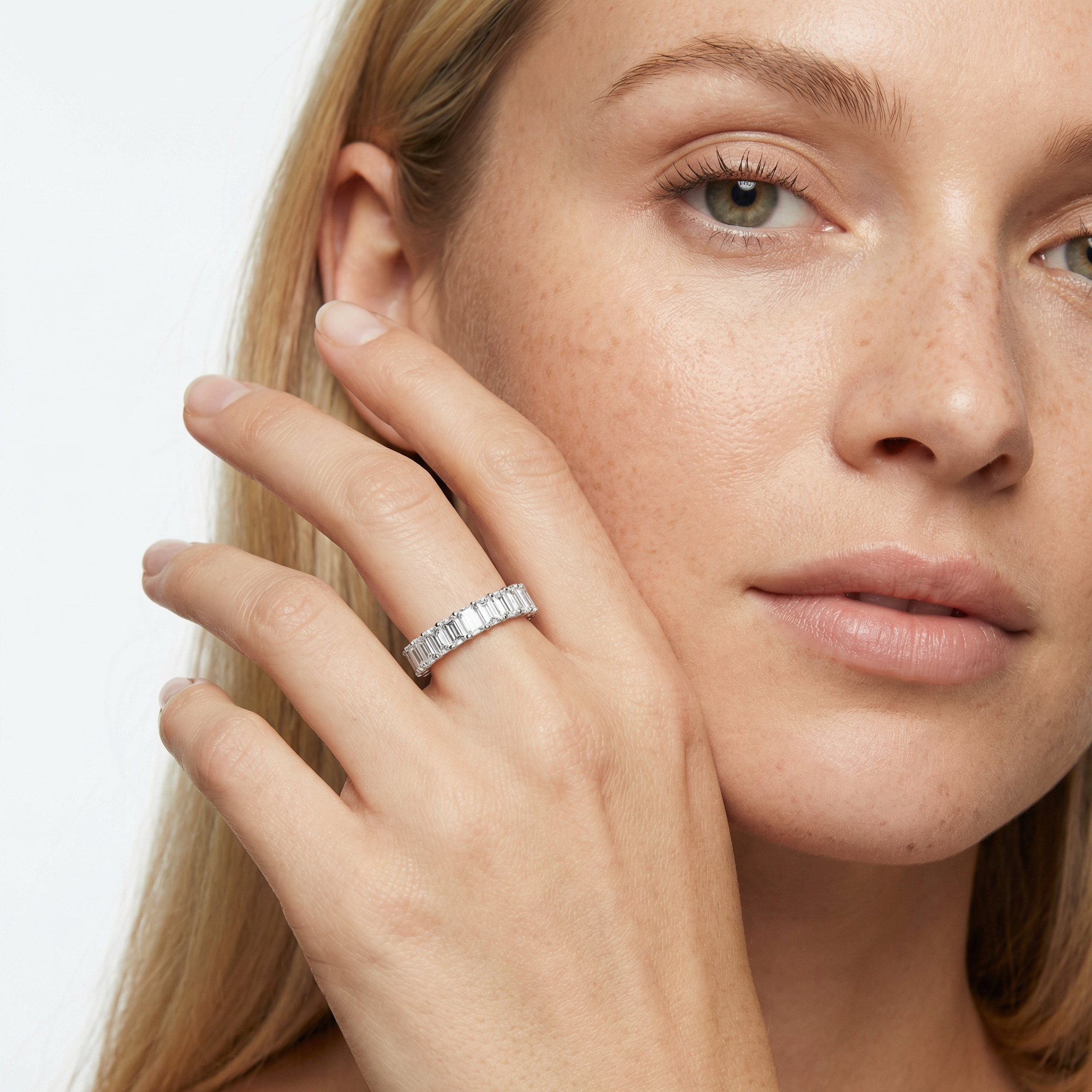 4 carat emerald lab grown diamond basket eternity band in 14k white gold on finger by Michael Gabriels