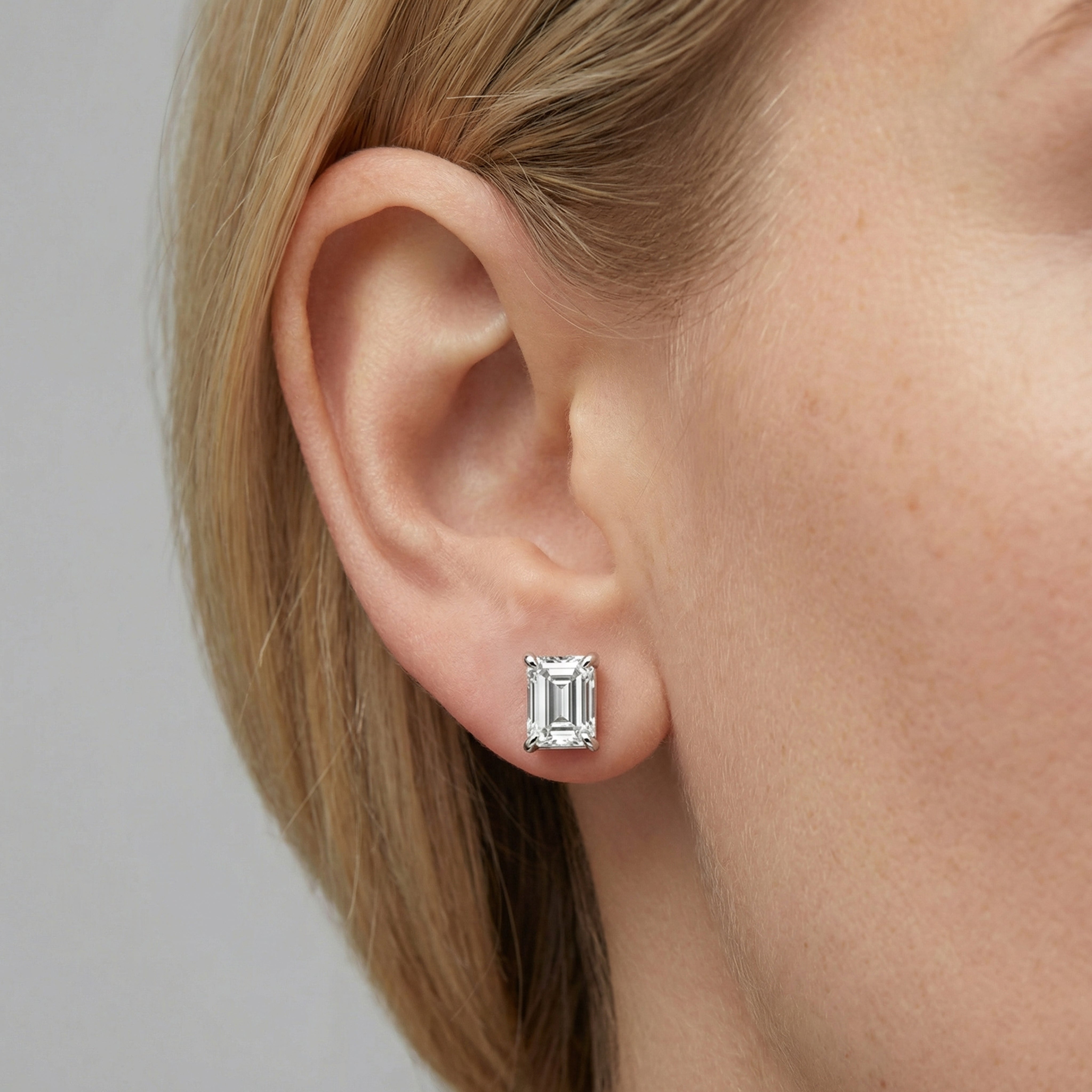 4 carat emerald lab grown diamond stud earring in 14k white gold on ear by Michael Gabriels