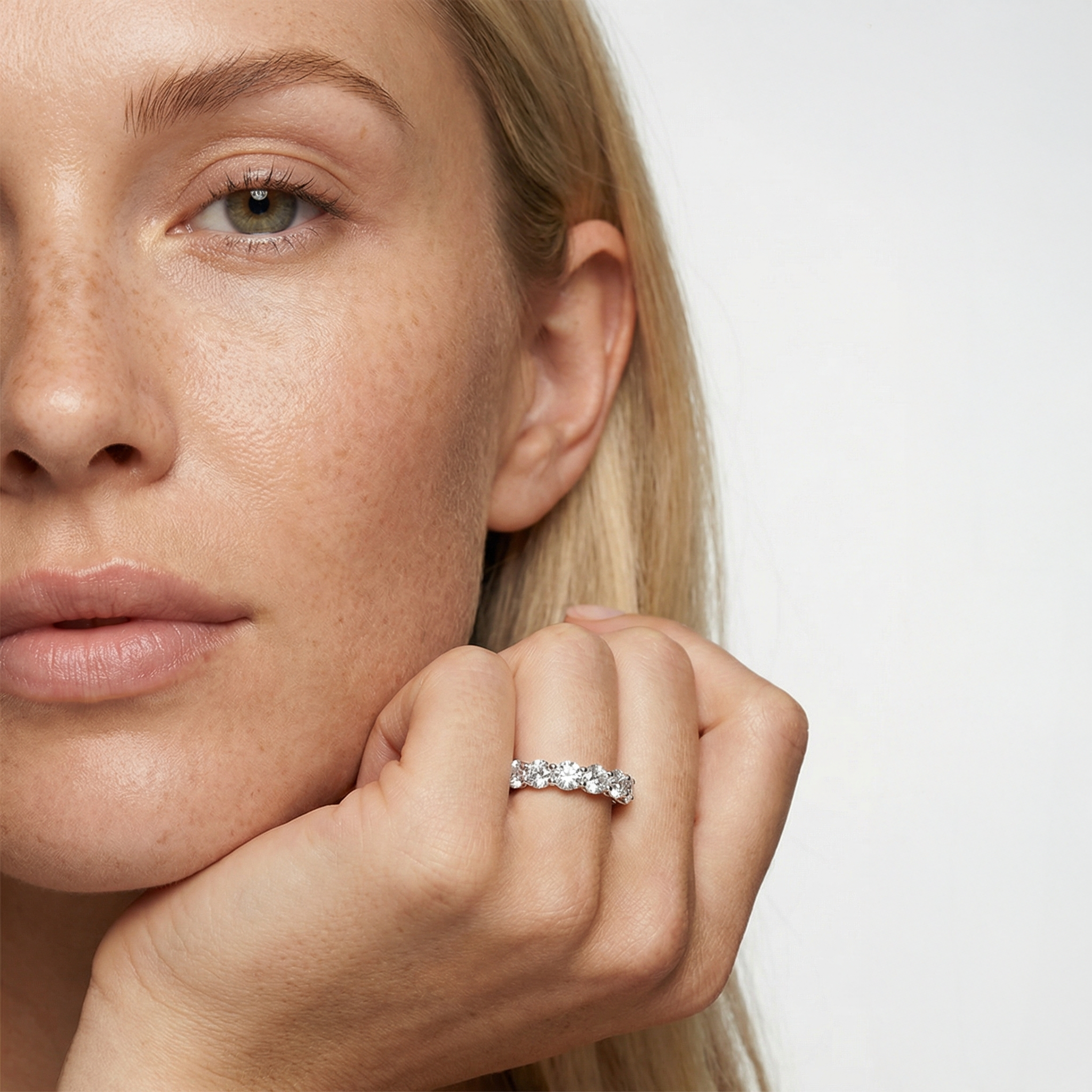 4 carat round lab grown diamond basket eternity band in 14k white gold on finger by Michael Gabriels