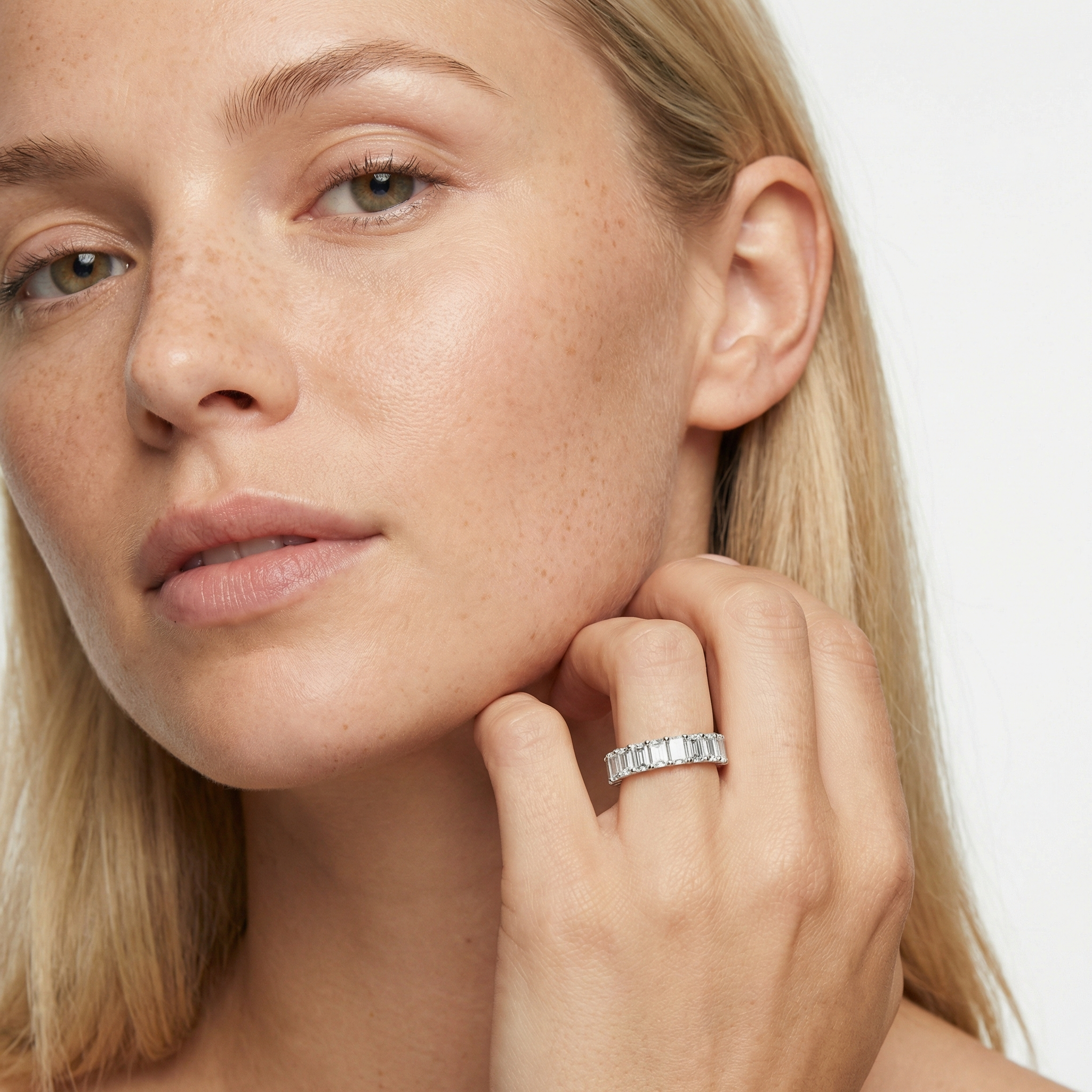 5 carat emerald lab grown diamond basket eternity band in 14k white gold on finger by Michael Gabriels