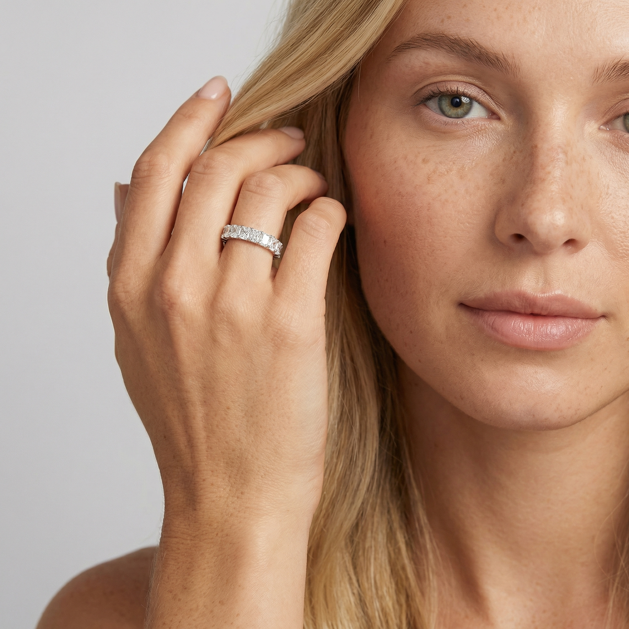 5 carat radiant lab grown diamond basket eternity band in 14k white gold on finger by Michael Gabriels