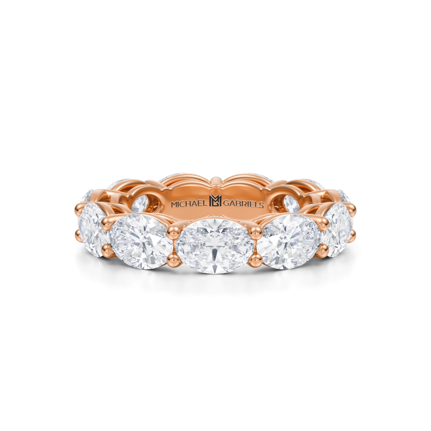 Rose gold eternity band with lab-grown diamonds in horizontal oval shape.