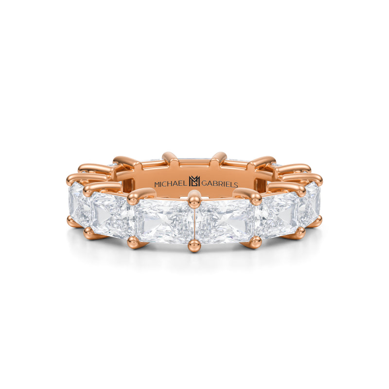 Rose gold eternity band with radiant lab-grown diamonds.