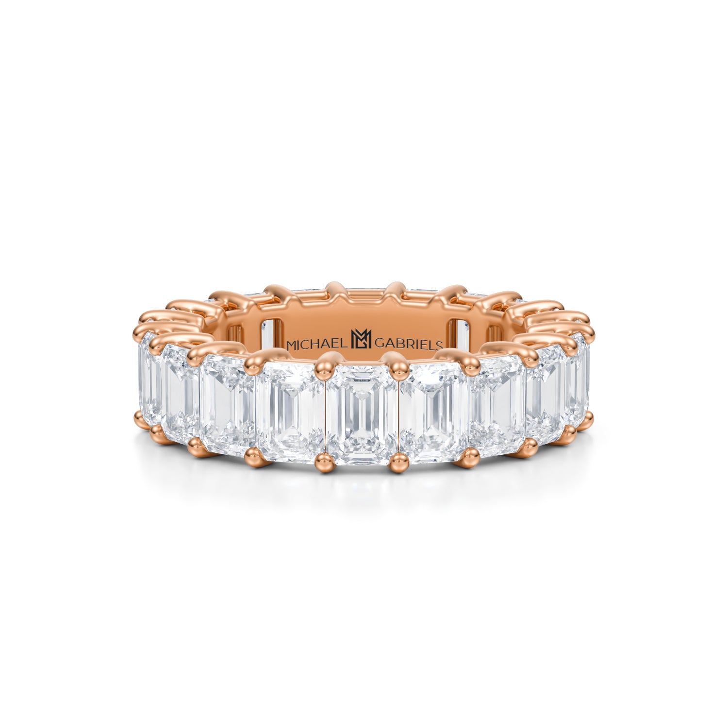 Rose gold eternity band with emerald lab-grown diamonds.