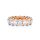 Rose gold eternity band with lab-grown diamonds in vertical oval shape.