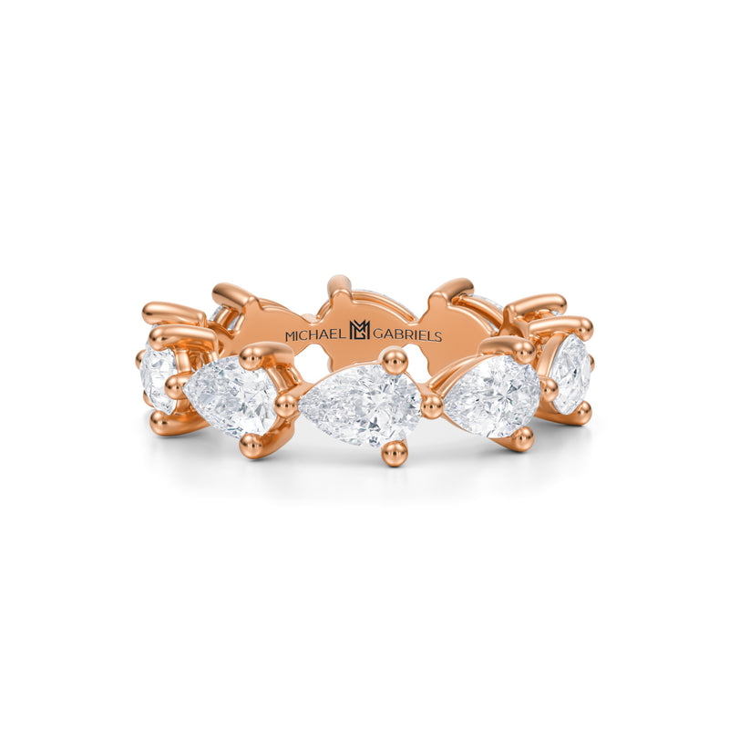 Rose gold eternity band with lab-grown diamonds.