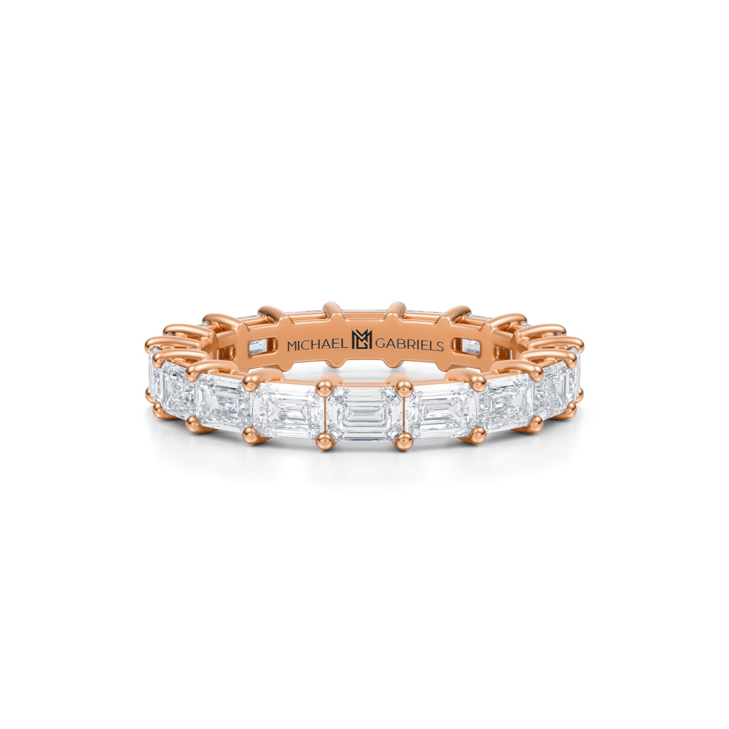 Rose gold eternity band with emerald lab-grown diamonds.