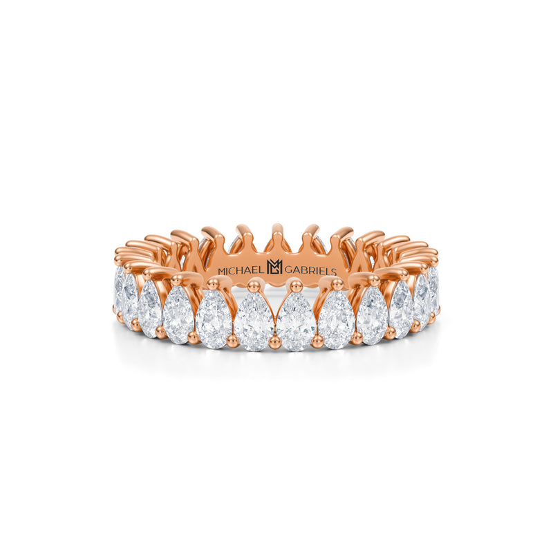 Rose gold eternity band with vertical pear lab-grown diamonds.