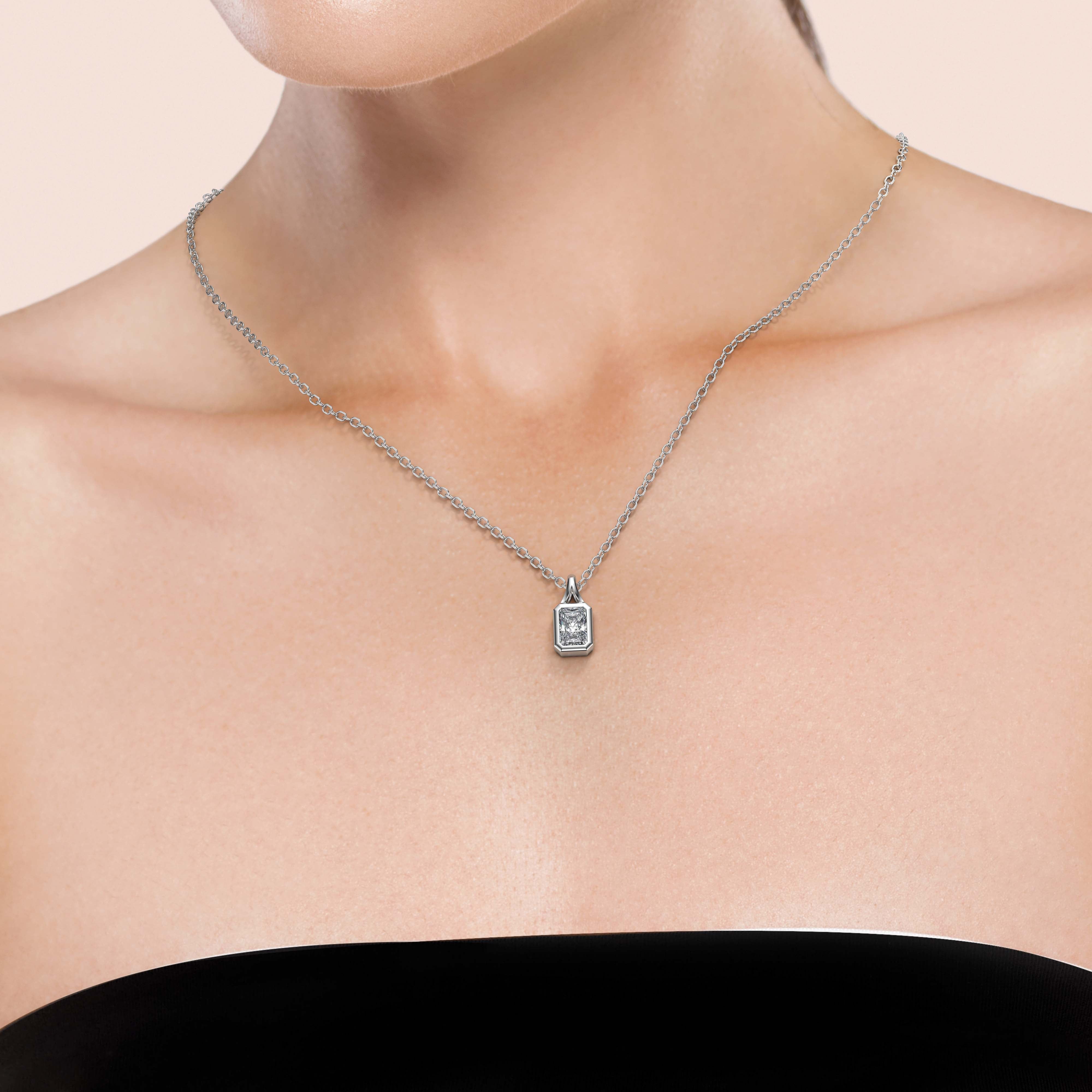 Elegant 1/2 Carat Radiant Lab Grown Diamond 
Split Bail Bezel Necklace, worn by Woman