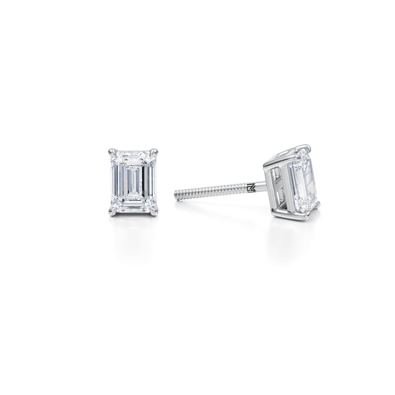 Emerald diamond stud earrings in white gold.