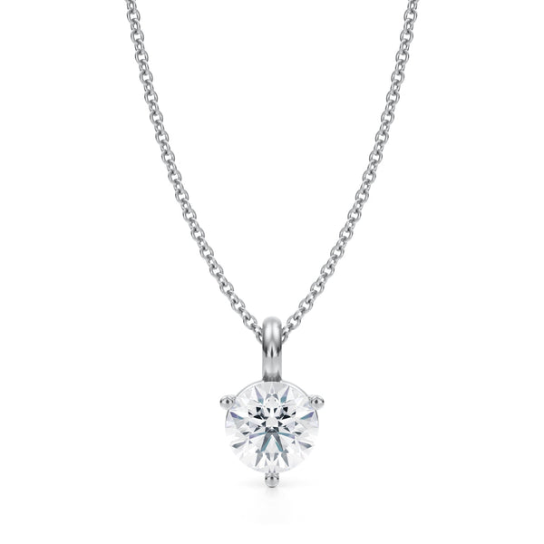 Accentuating the white gold necklace, a woman radiates elegance with a captivating 1 carat round cut lab diamond.