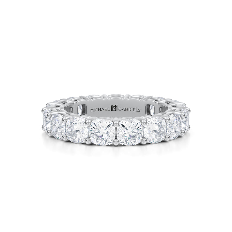 White gold eternity band with cushion cut lab grown diamonds.