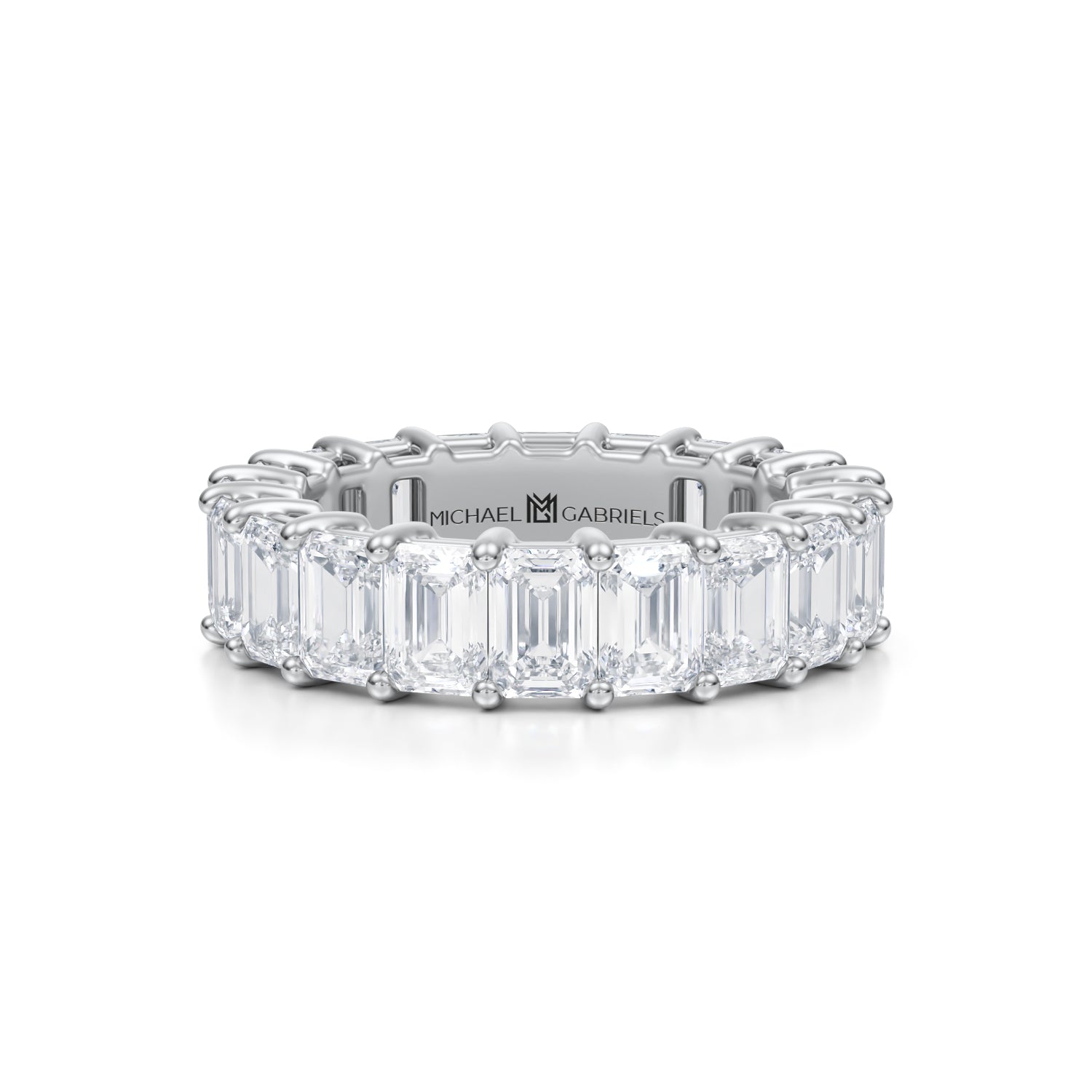 Emerald eternity band in white gold.