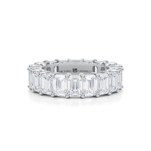 Emerald eternity band in white gold.
