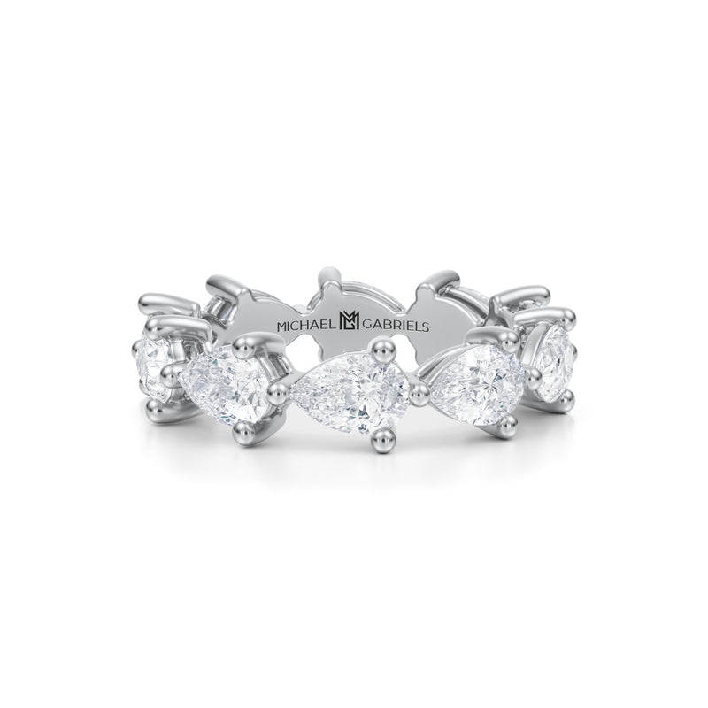White gold eternity band with lab-grown pear diamonds.