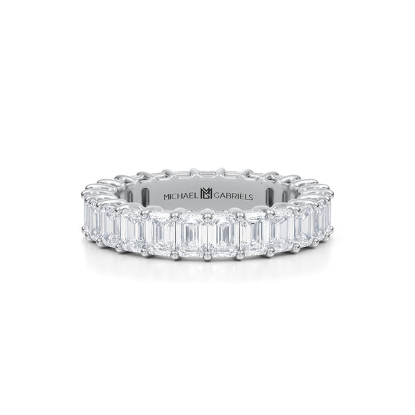 Petite white gold eternity band with vertical emerald lab grown diamonds.