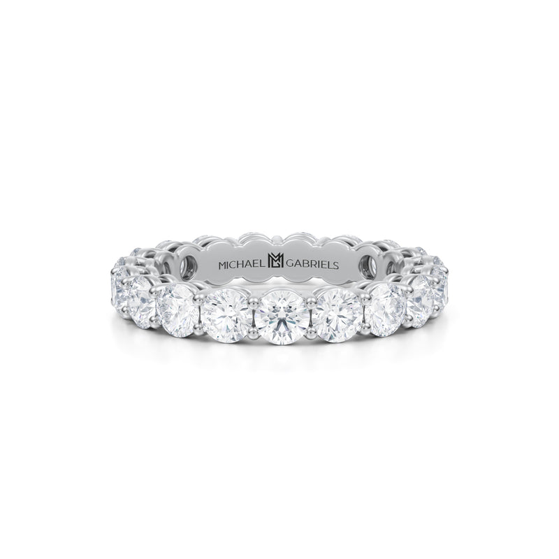 Petite white gold eternity band with lab grown diamonds.