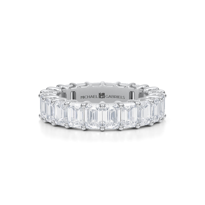 Small emerald eternity band in white gold.