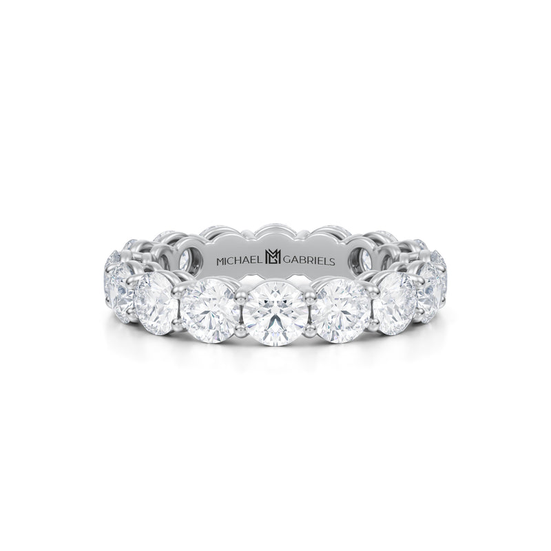 Small white gold eternity band with round lab grown diamonds.